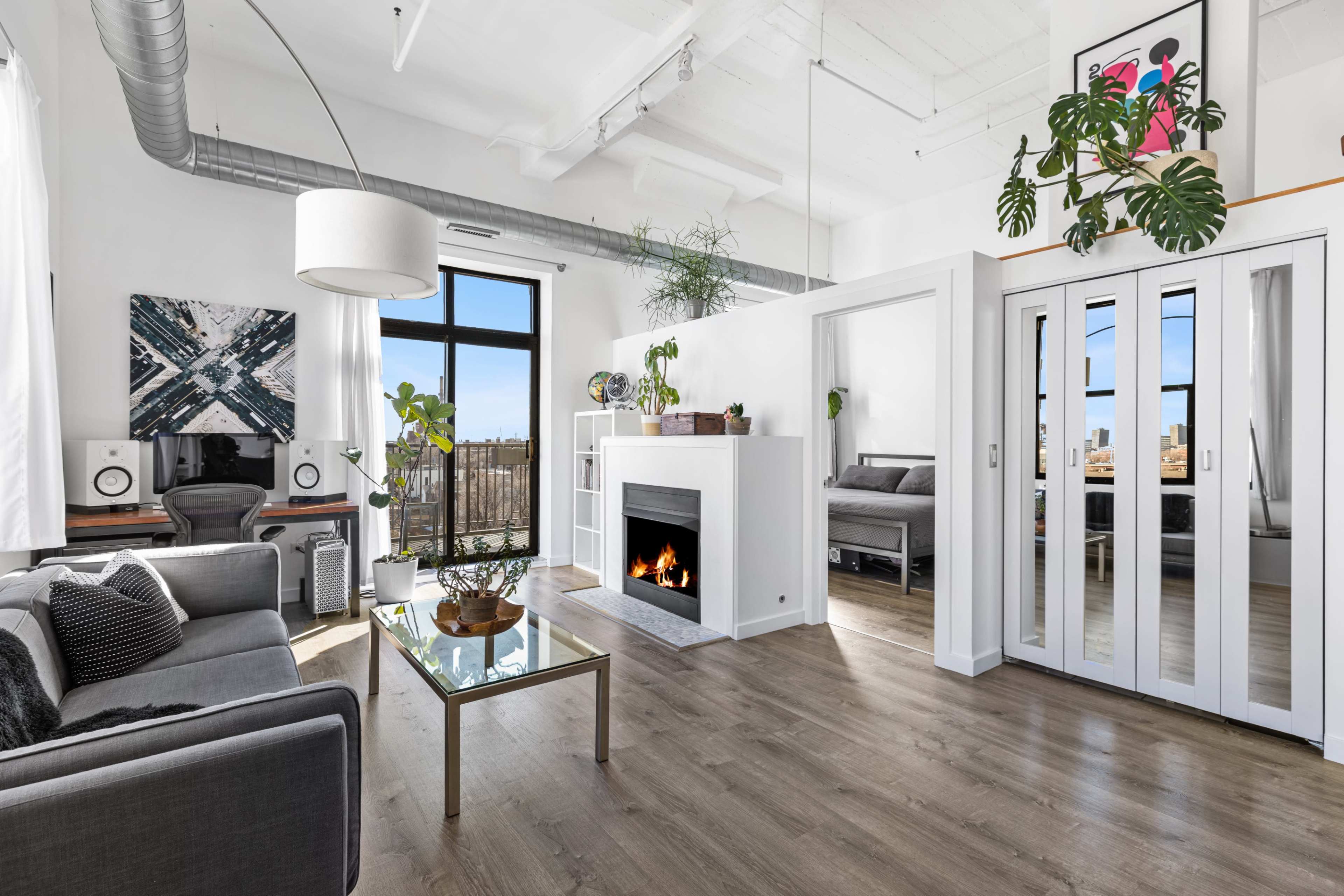 Modern & Historic Loft w/ 20ft Ceilings, South+East Facing Windows, Skyline Views, and Private Balcony Image in Near West Side, Chicago, IL