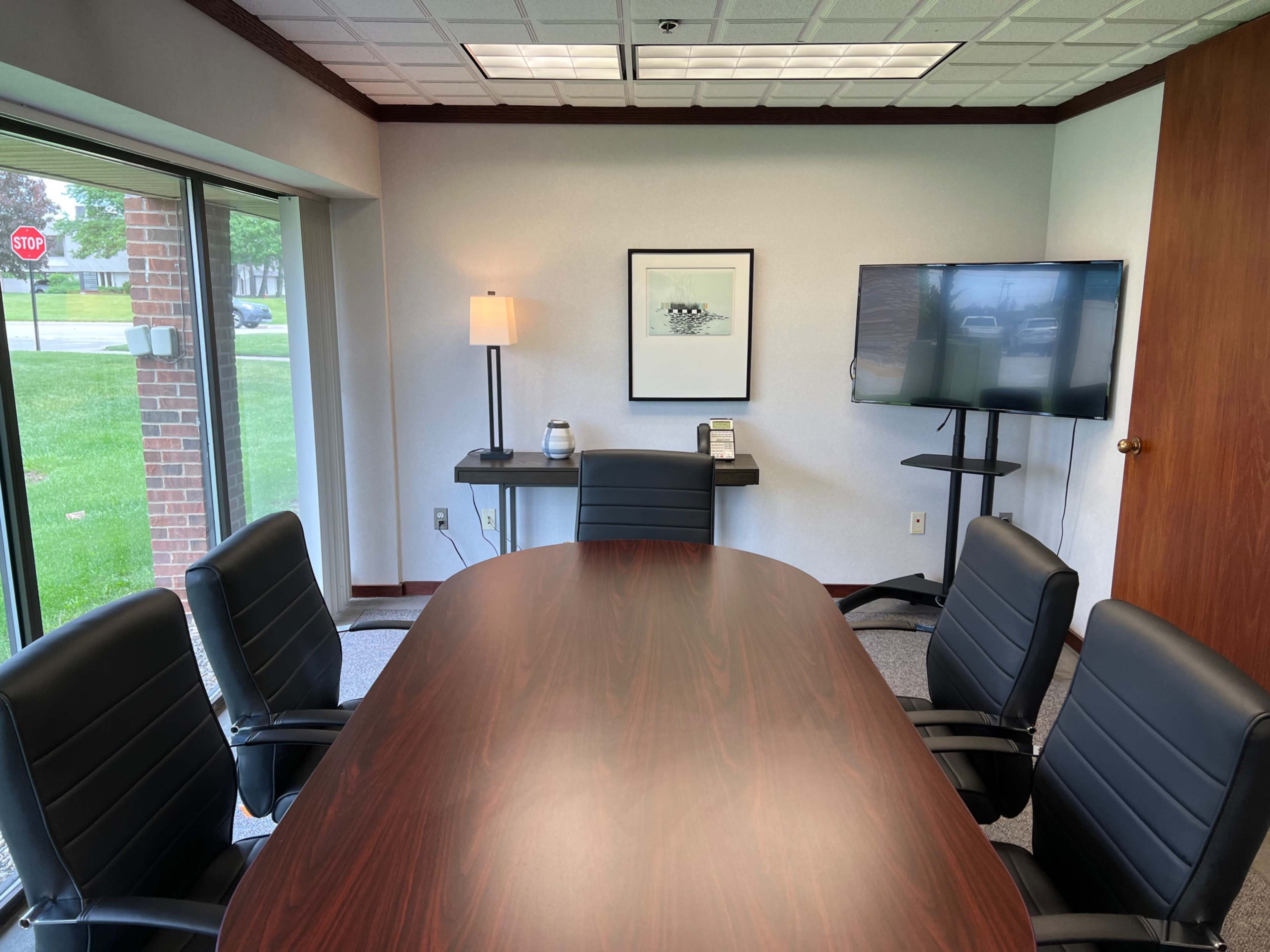 Spacious Meeting Room for 6 w/ TV & Large Windows Image in , Troy, MI