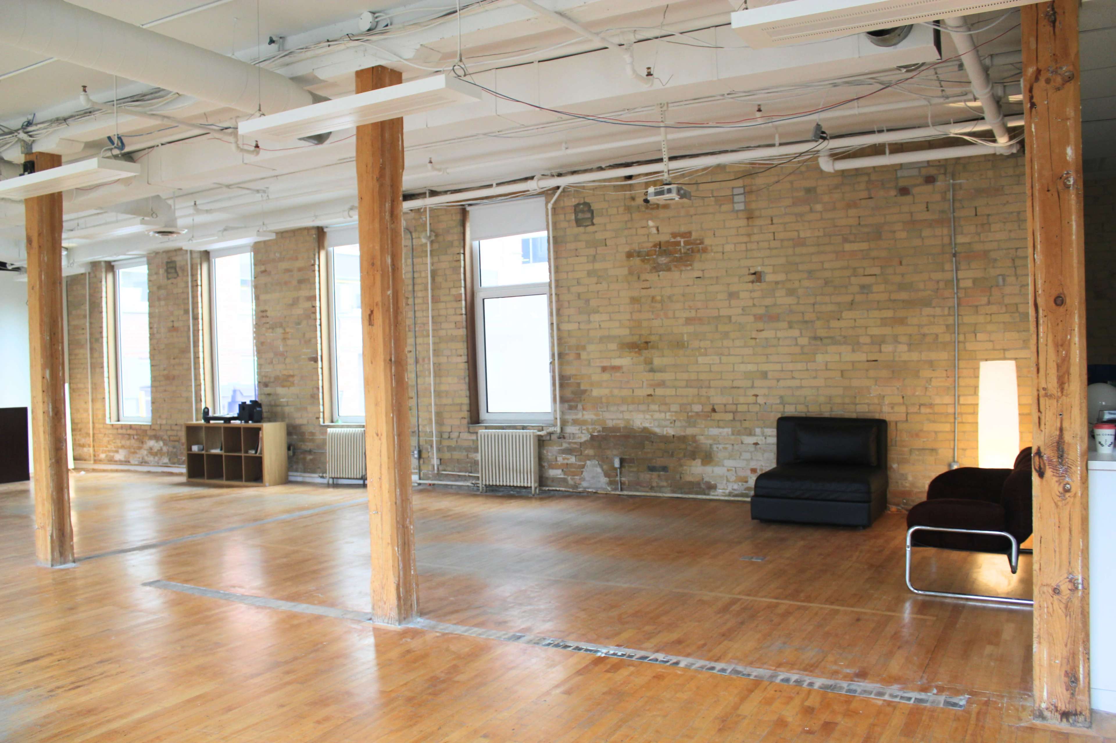 Downtown Loft with Natural Light, Brick, and Exposed Wooden Beams Image in Downtown Toronto, Toronto, ON