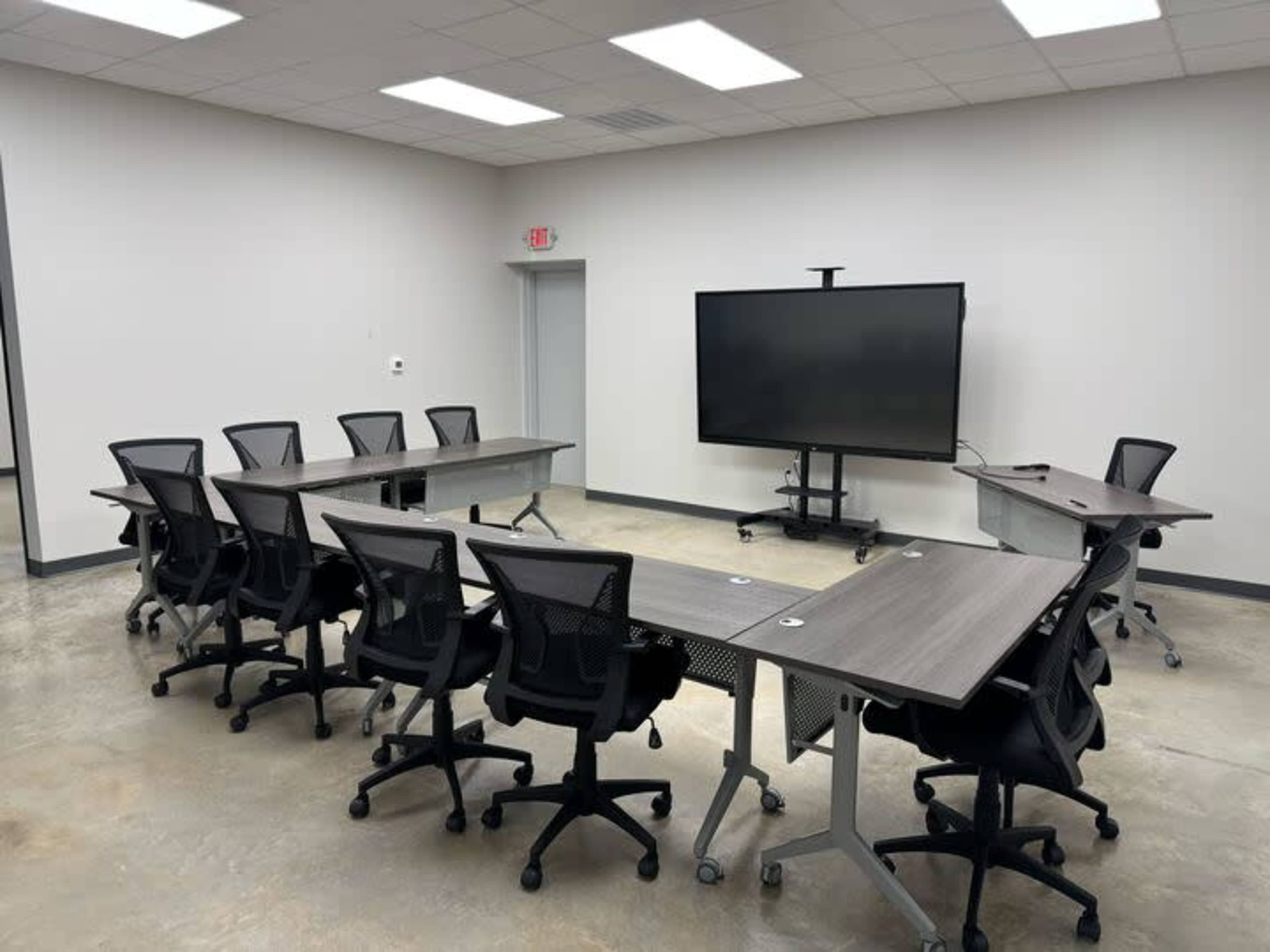 Industrial Boardroom | Seats 12 | 86" Smart Board Image in Conroy Park, Manchaca, TX