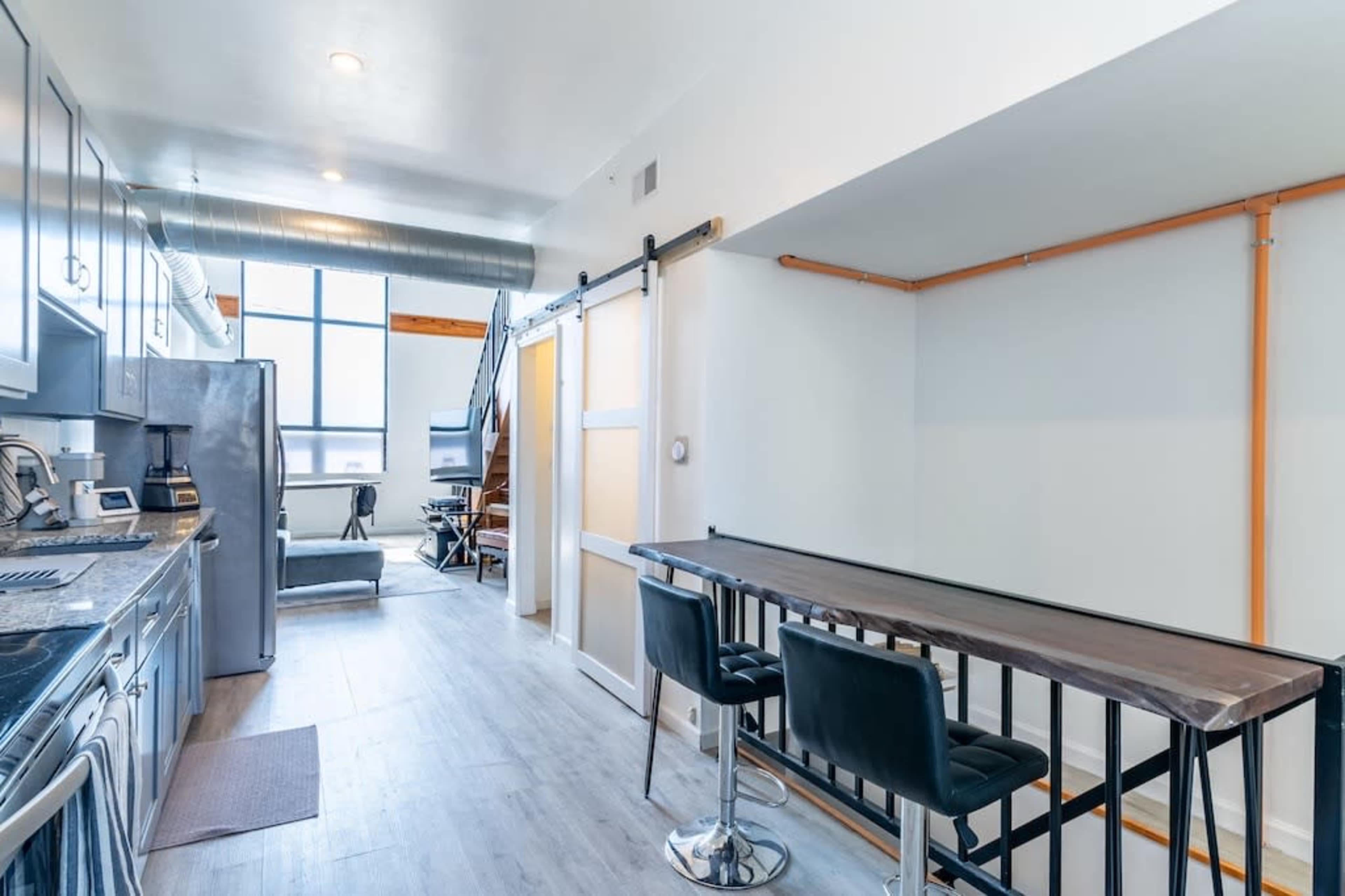 Urban Loft Oasis with Beautiful Natural Light, Piano, & Rooftop with Skyline Views. Image in East Passyunk Crossing, Philadelphia, PA