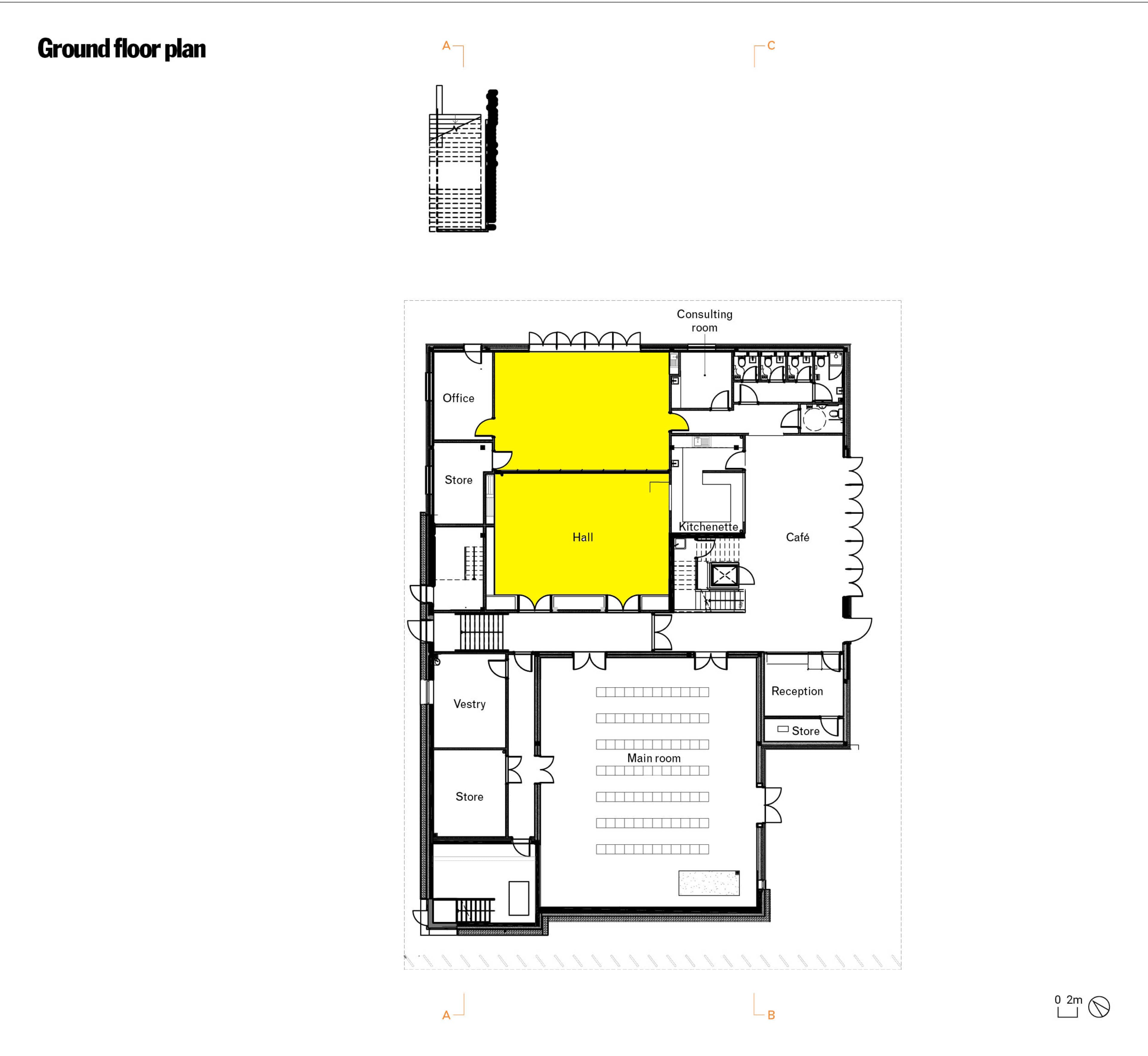 A ground floor plan of a building, highlighting areas designated as a hall and adjoining spaces such as offices, stores, a café, and a reception area.