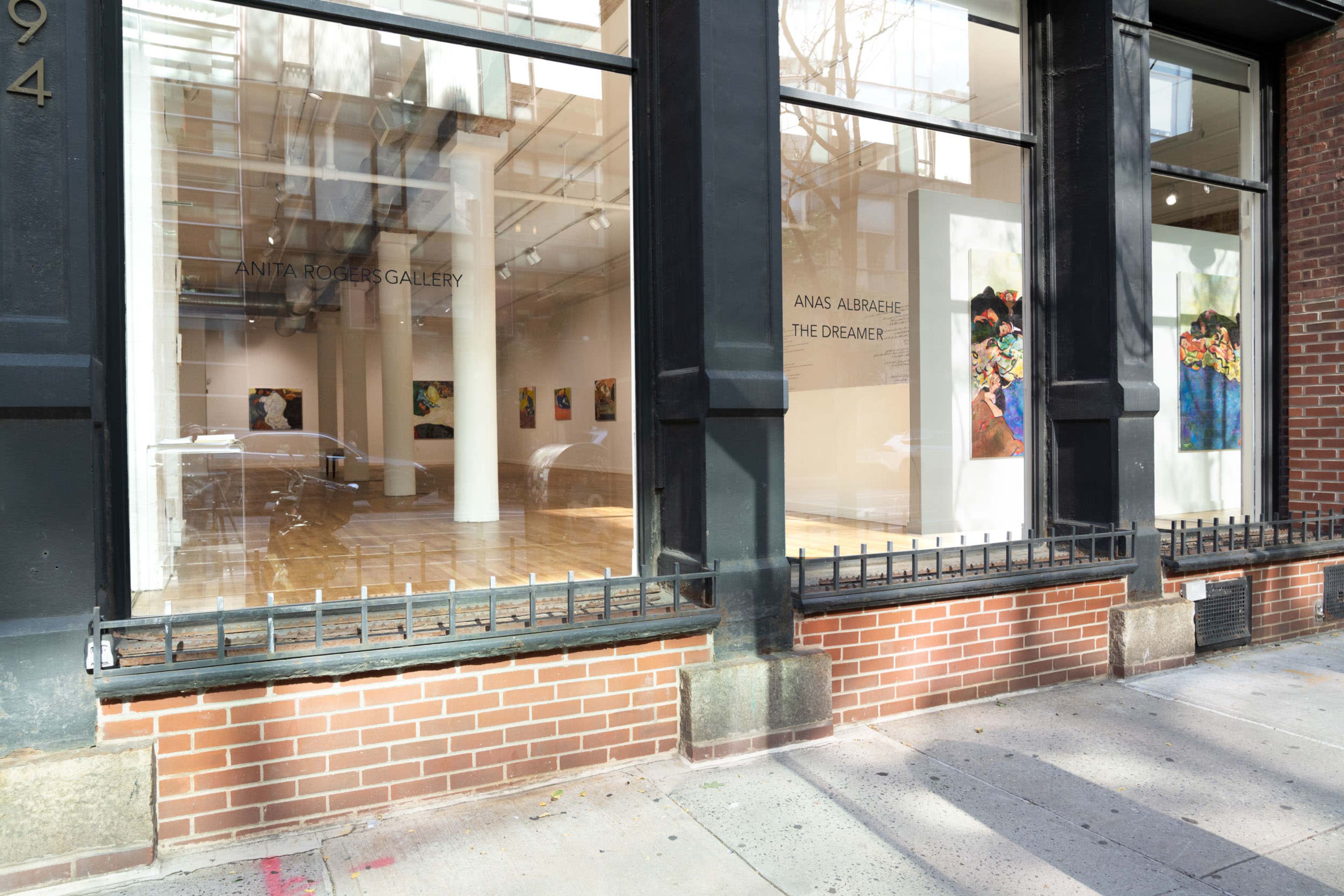The exterior of the Anita Rogers Gallery with artwork visible through the large windows.