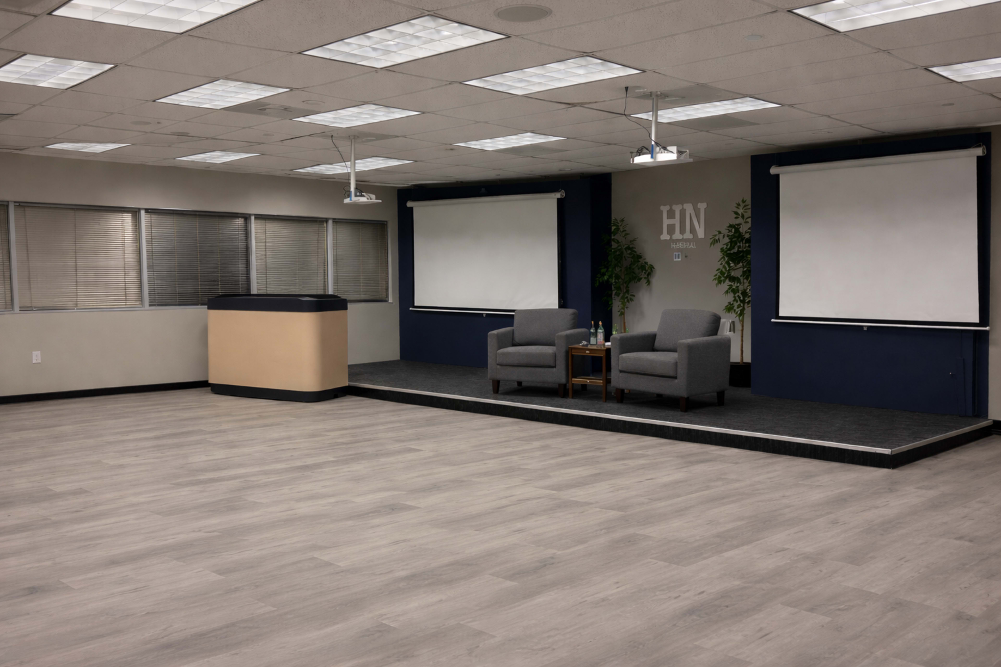 Corporate Event Suite with Stage & Dual Screens Image in Briar Forest, Houston, TX