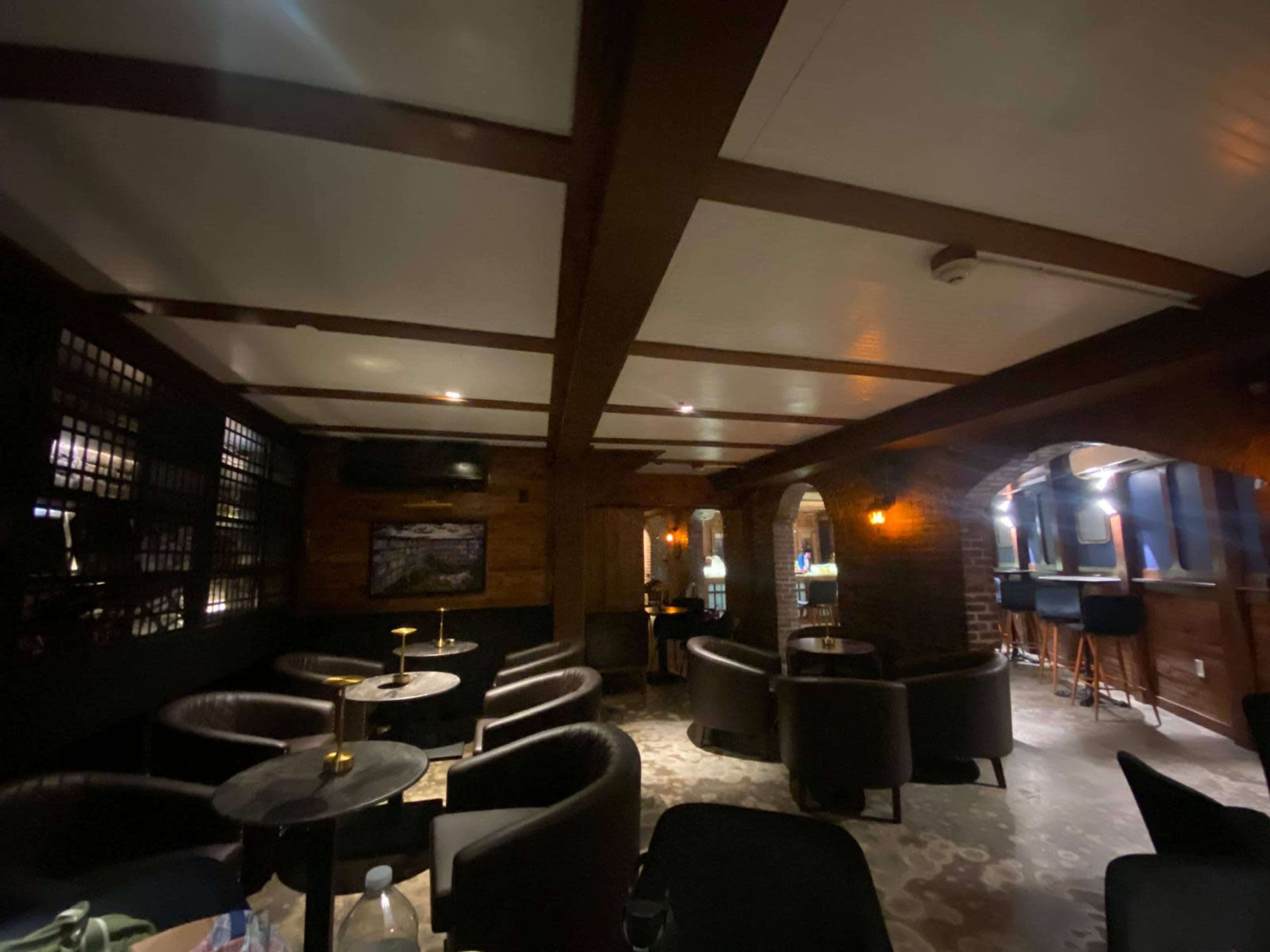 Intimate refined lounge with exposed brick in Park Slope Image in Park Slope, nyc, NY