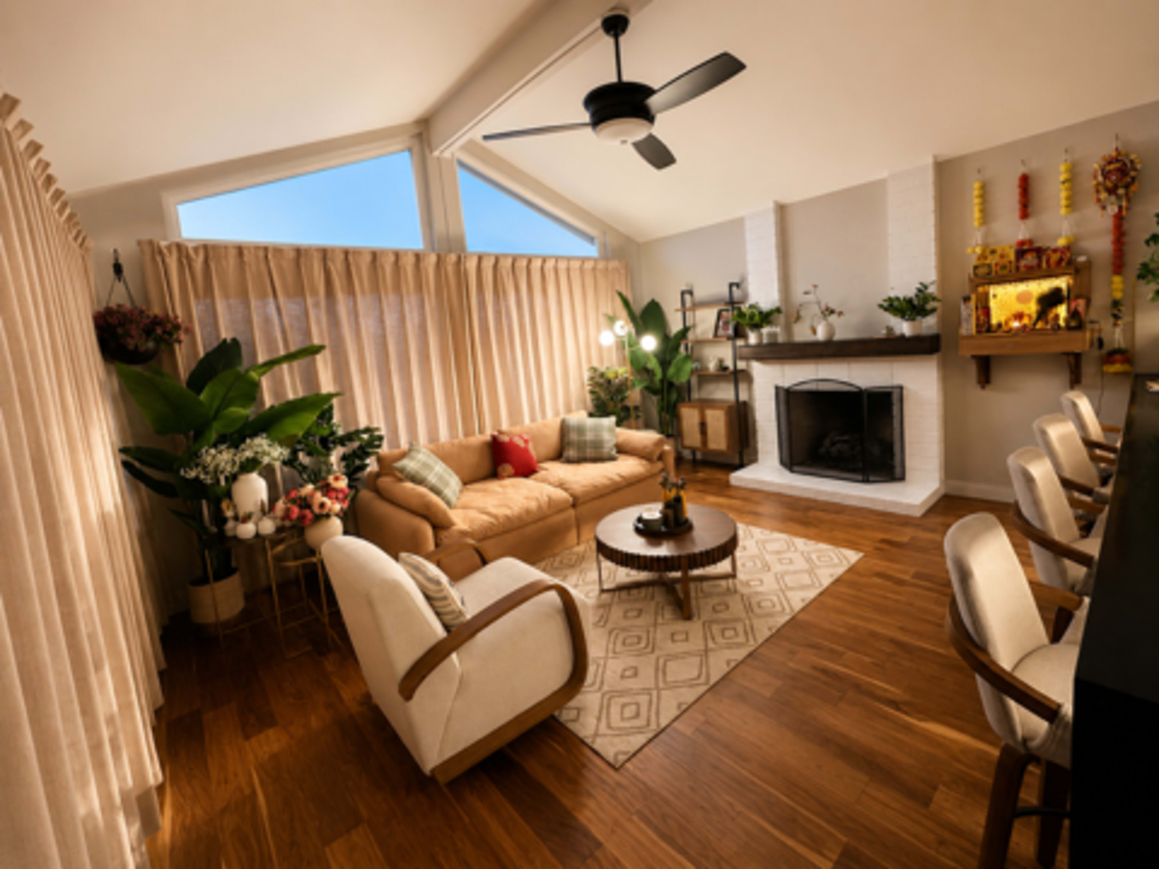 A modern living room features a brown leather sofa, two white armchairs, a round coffee table, and a fireplace with decorative items, all illuminated by natural light through large windows.