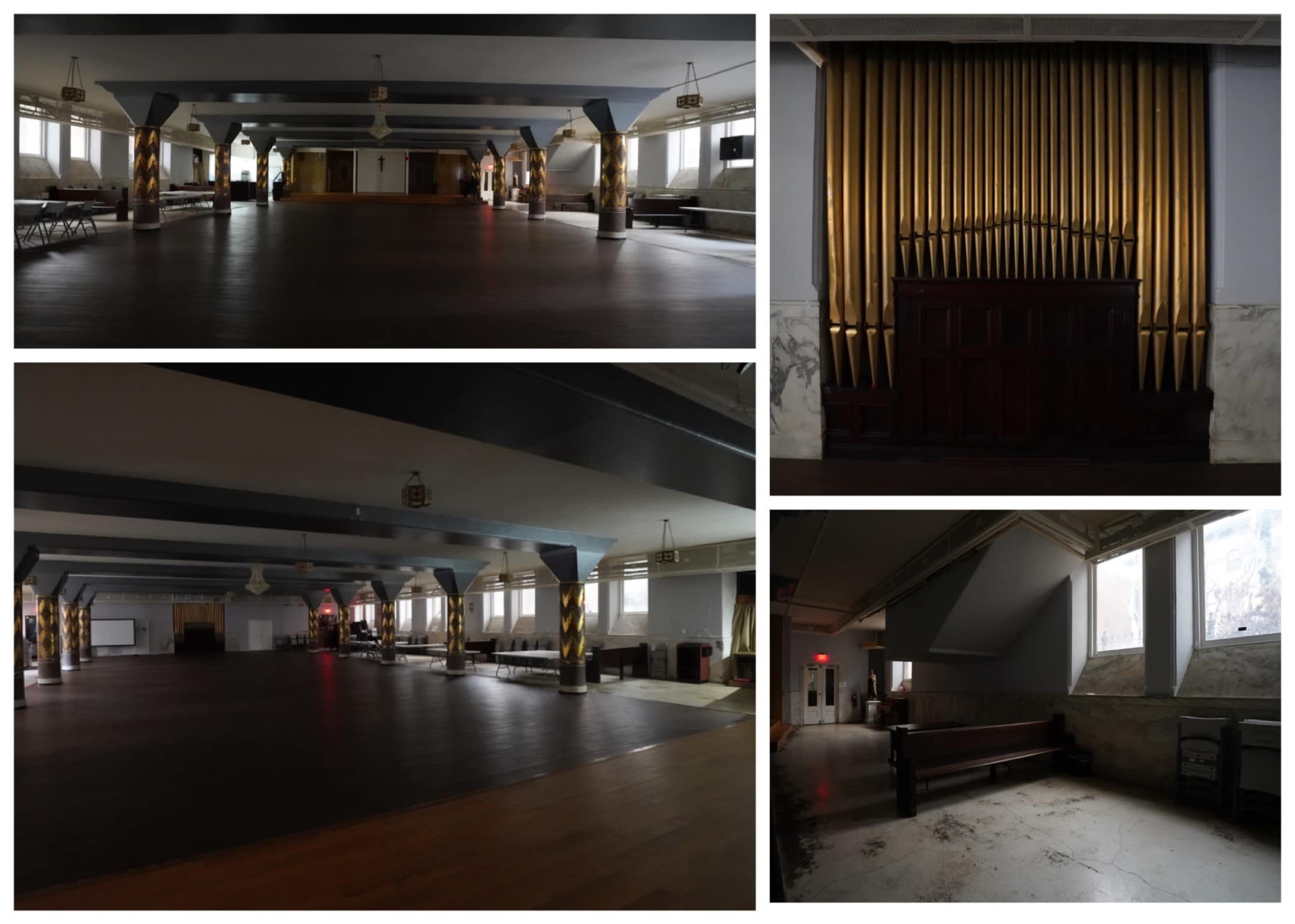 A large, dimly lit hall with polished wooden floors, featuring an ornate pipe organ on one wall and empty spaces arranged with benches and tables.
