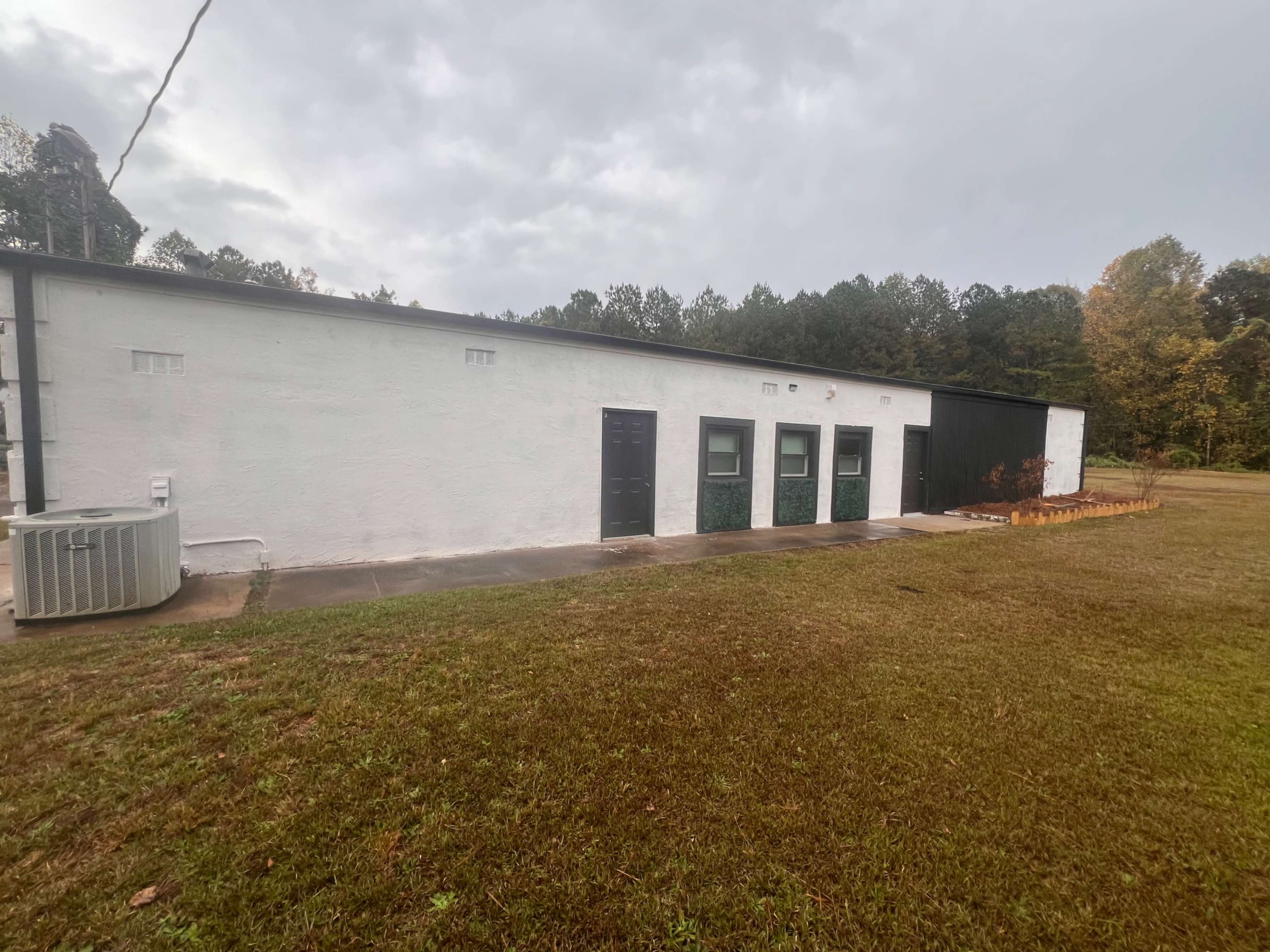 Suburban Area with stand alone building on top of the hill near fire station Image in , Stone Mtn, GA