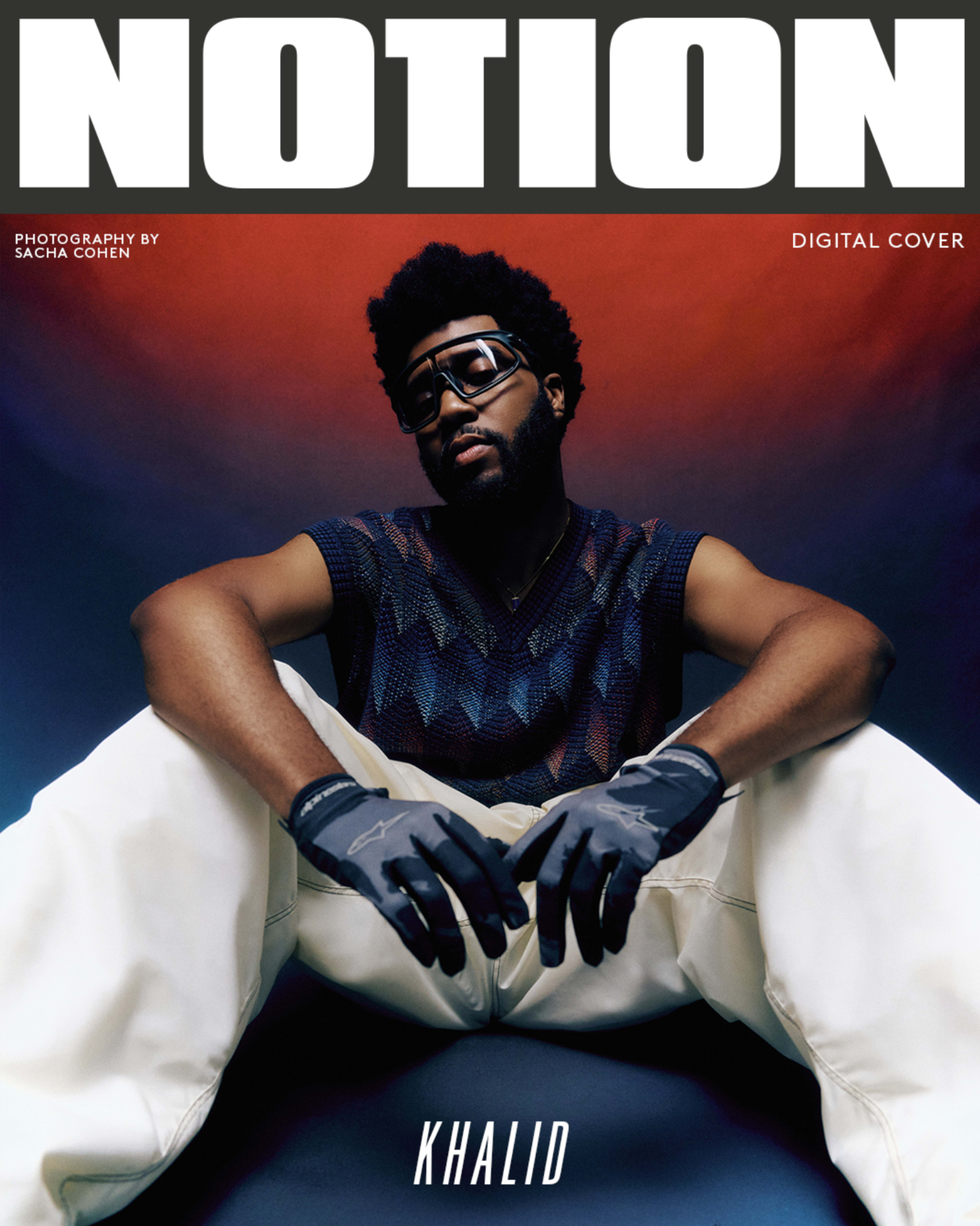 A male artist poses seated in a stylish outfit on the digital cover of Notion magazine, featuring bold text and dramatic lighting.