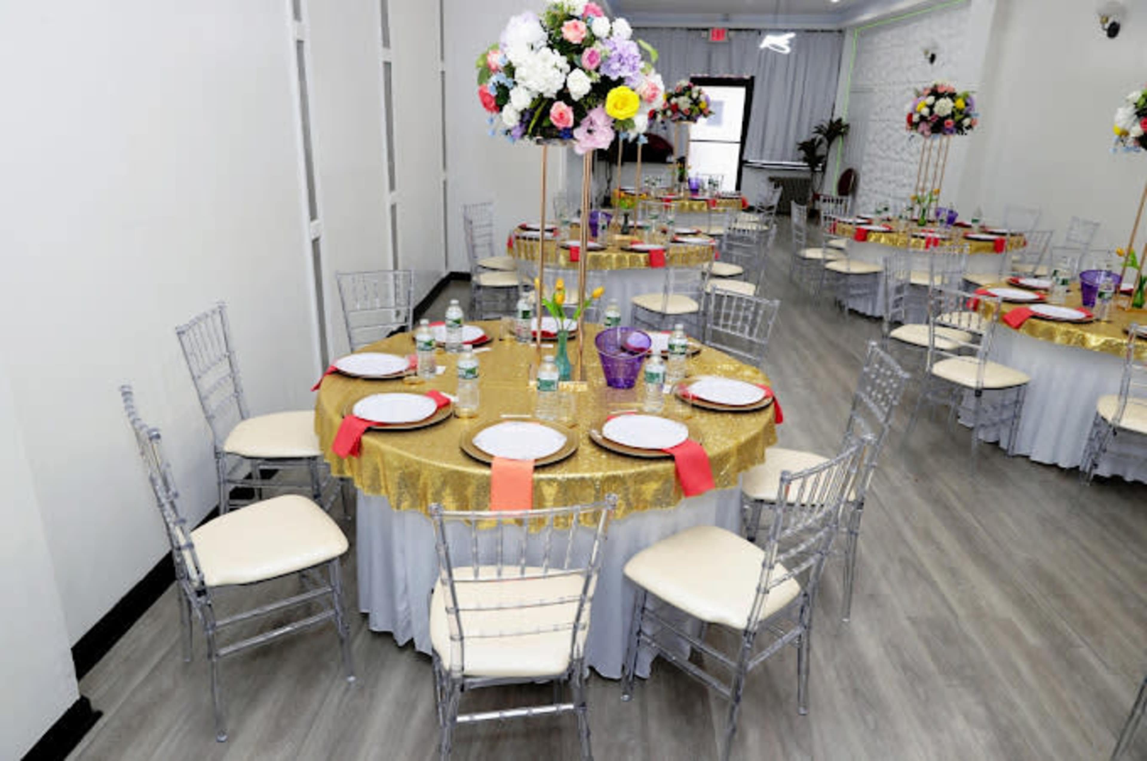 An all white  sAtunning Premier Event Venue with Accent and Flower Walls. Image in Jamaica, Queens, NY