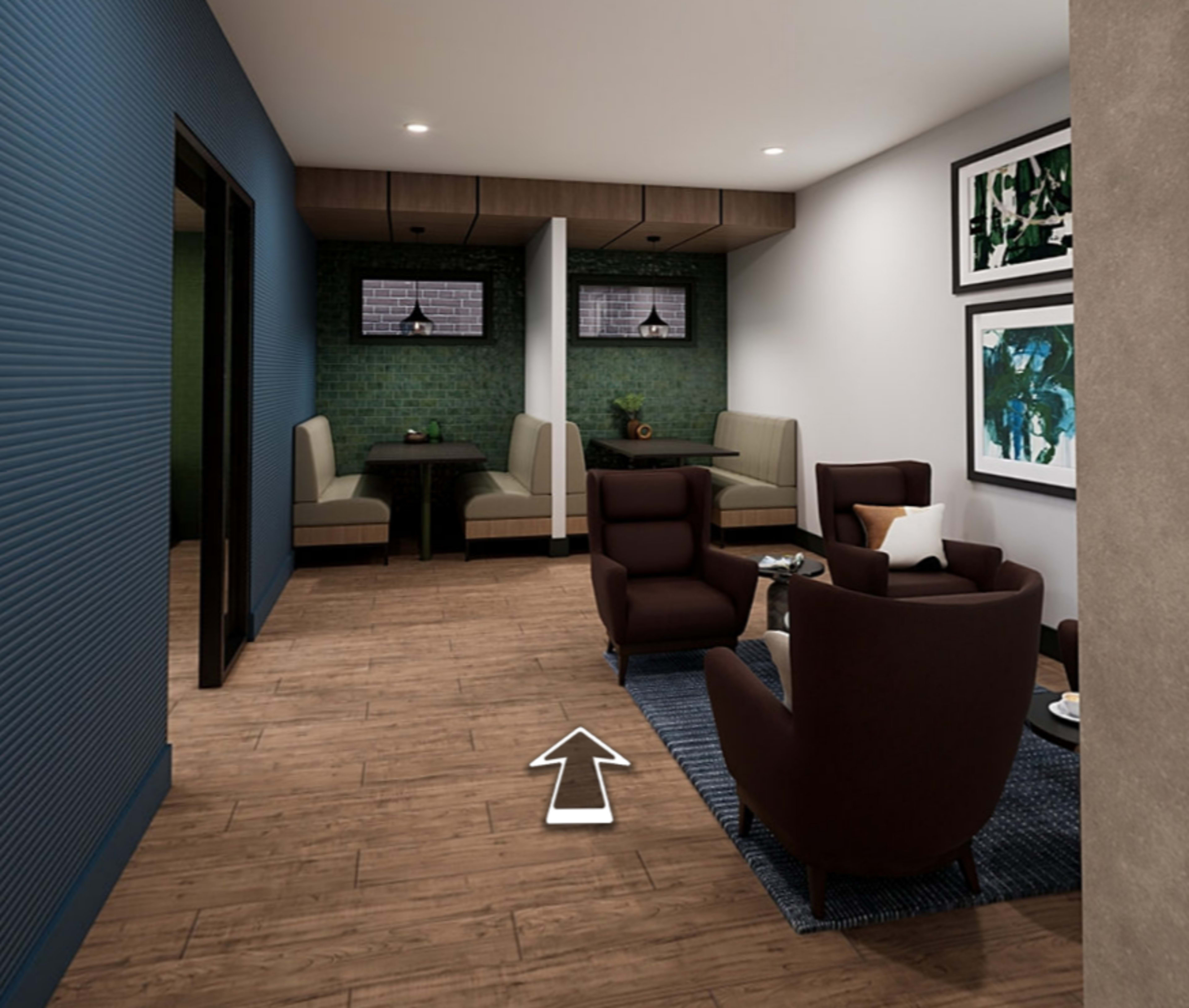 A modern lounge area with two seating booths and two armchairs arranged around a low table on a wooden floor.
