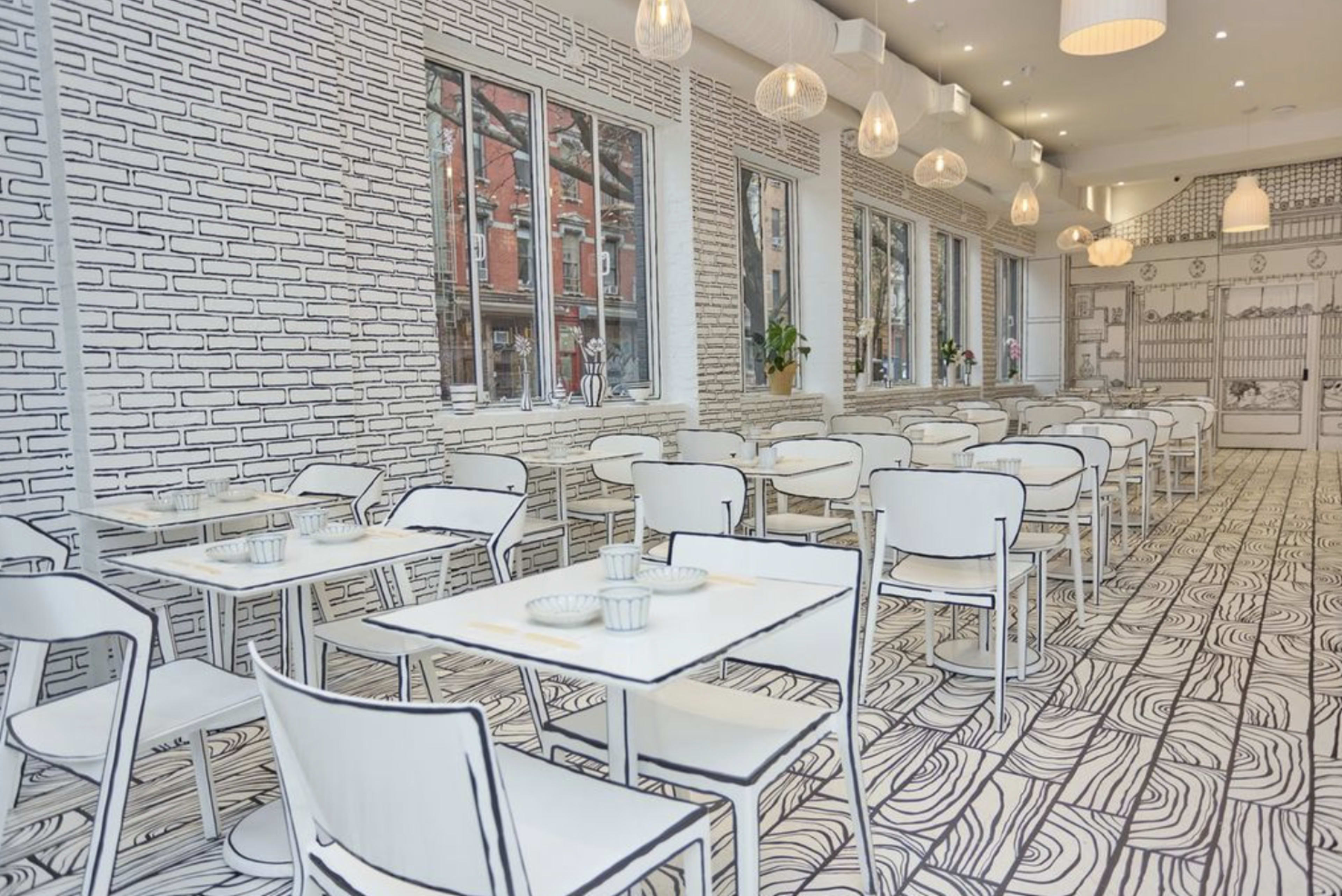 The image shows a minimalist restaurant interior with white tables and chairs against a hand-drawn mural of brick walls and wavy patterns on the floor.