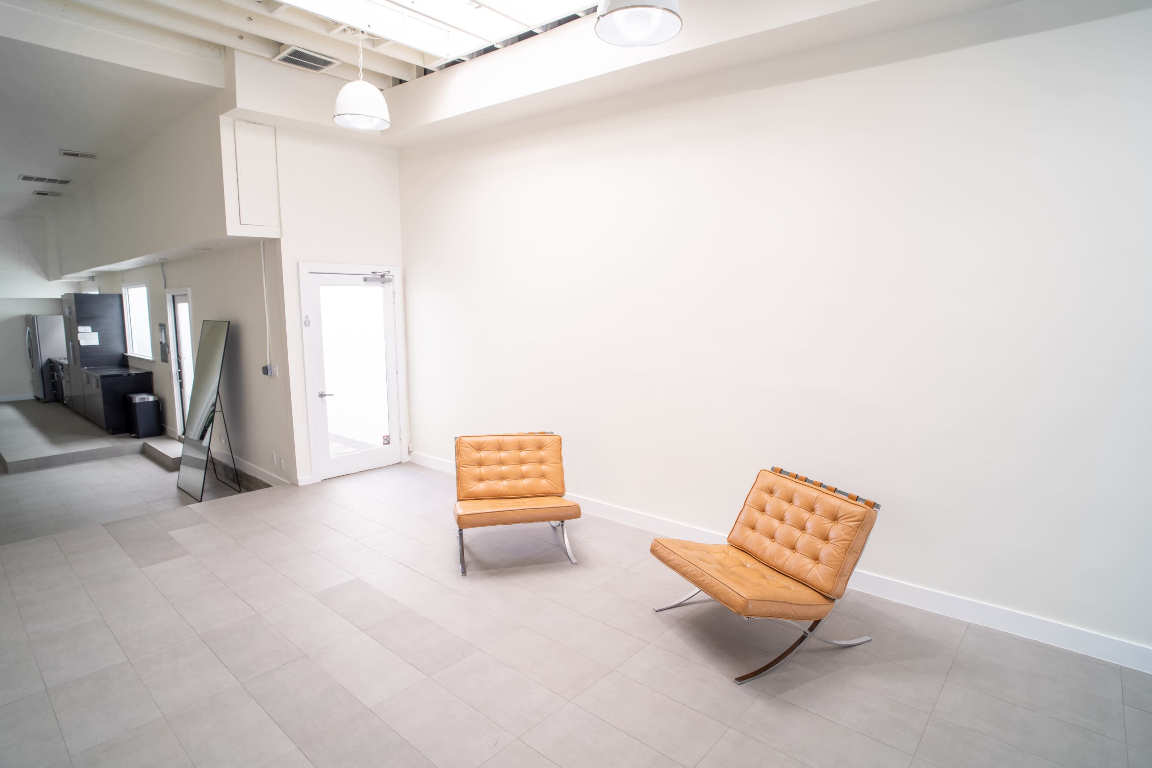Melrose Fairfax District Minimalist Daylight Photo Video Pop-Up Studio Space with Modern Minimalist Furnishings and Backdrops Image in Beverly Grove, Los Angeles, CA