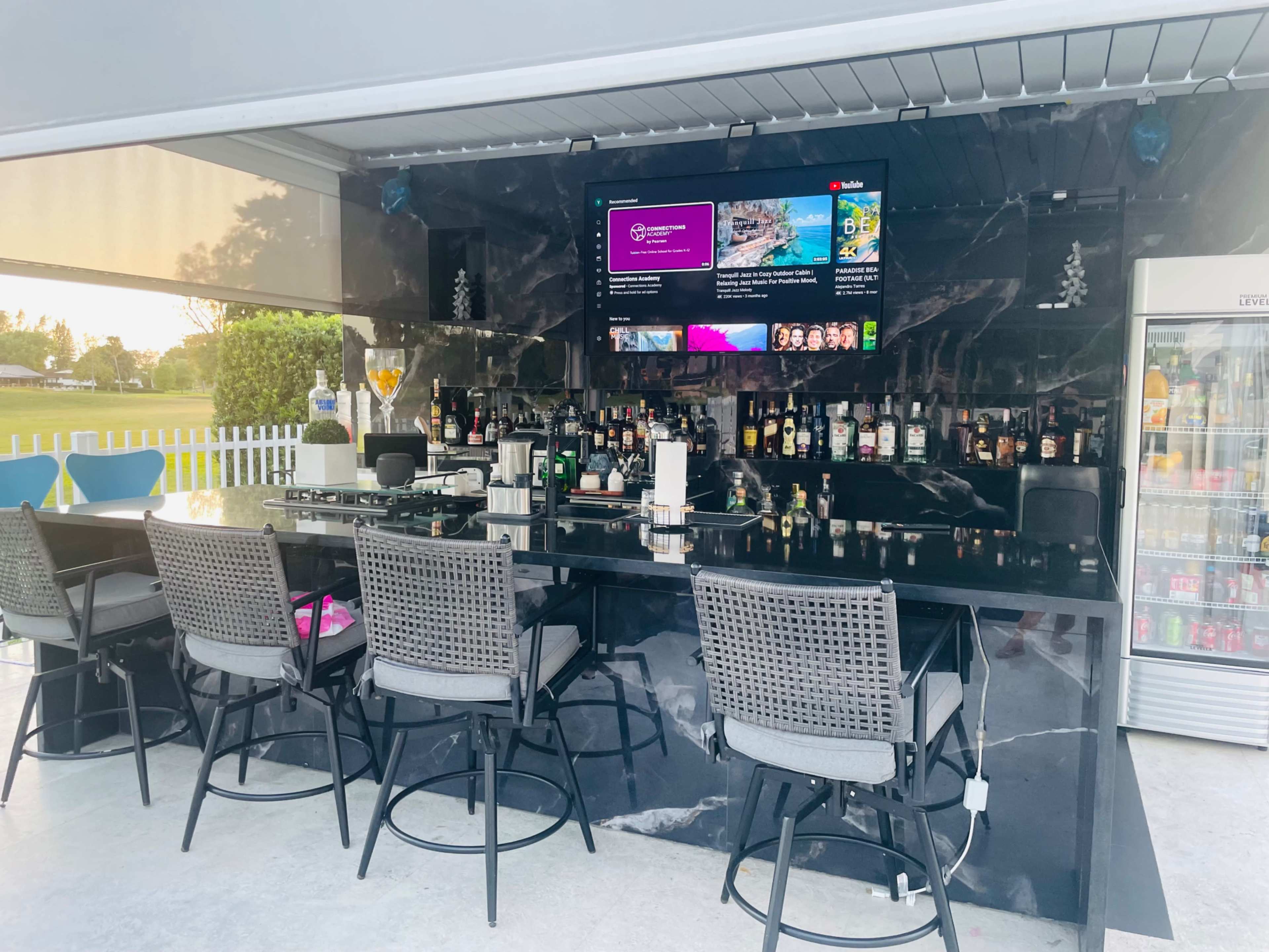 Country club, suburban, outdoor area with pool. Golf course view, roomy area with plenty of seating. Image in Country Club, Miami, FL