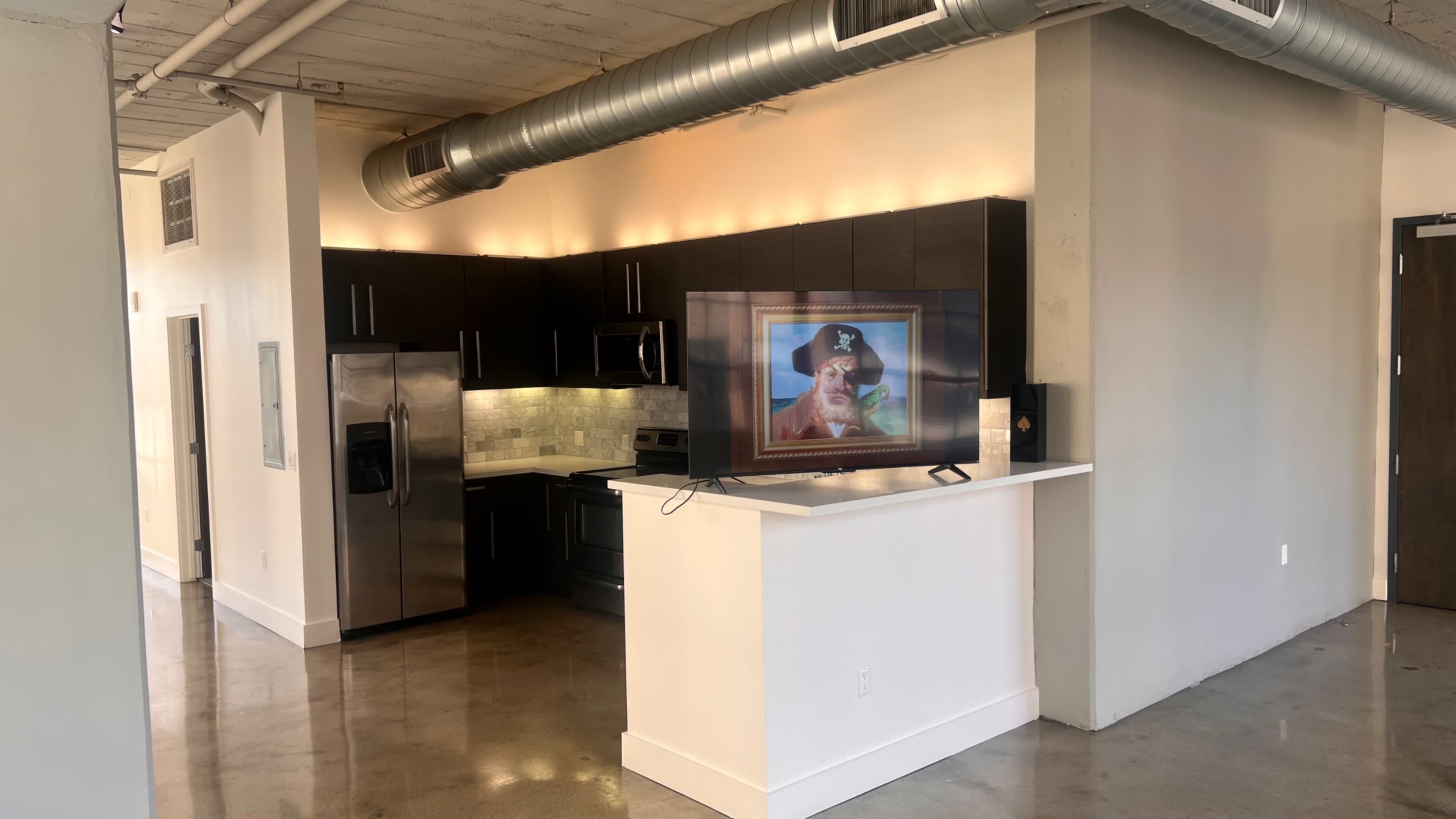 Image showcasing Downtown Studio loft space with city skyline and natural lighting., Los ...