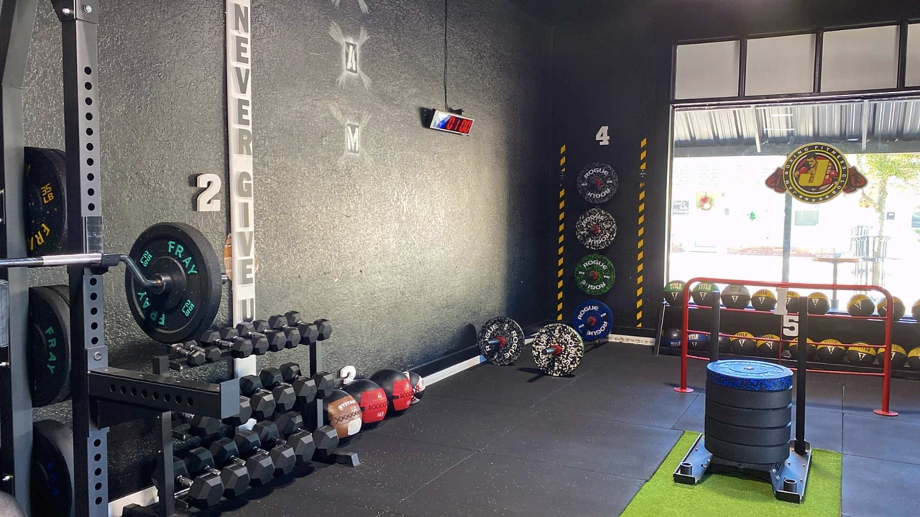Full Boxin Gym / Boxing Ring / Punching Bags / Weights Area (Old Bricks Walls) (Black Walls) Downtown Saint Cloud Fl Image in St. Cloud, Saint Cloud, FL