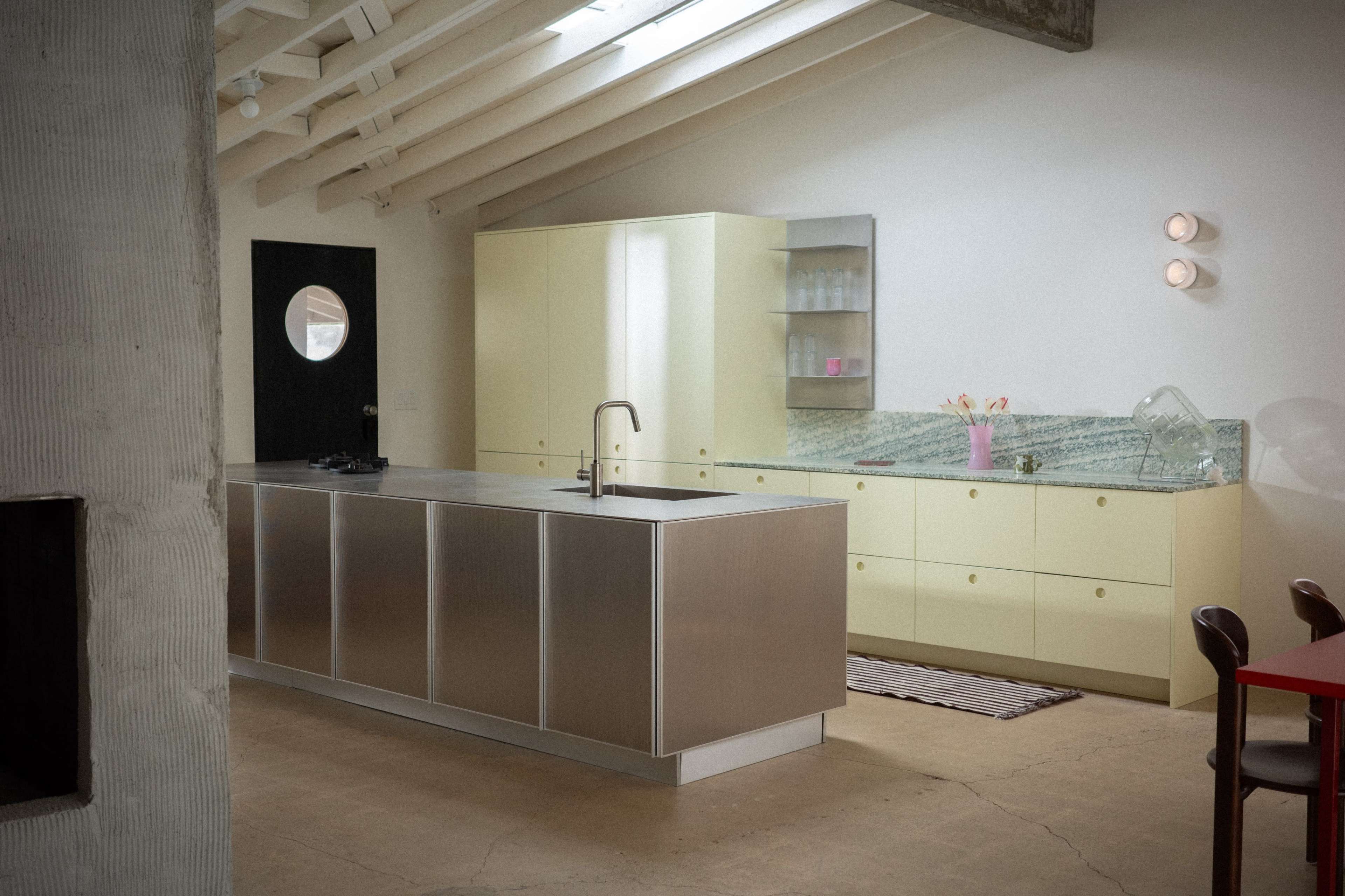 Naturally lit Coastal Ranch with danish kitchen, stainless steel and colorful plywood furniture Image in College Park, Costa Mesa, CA