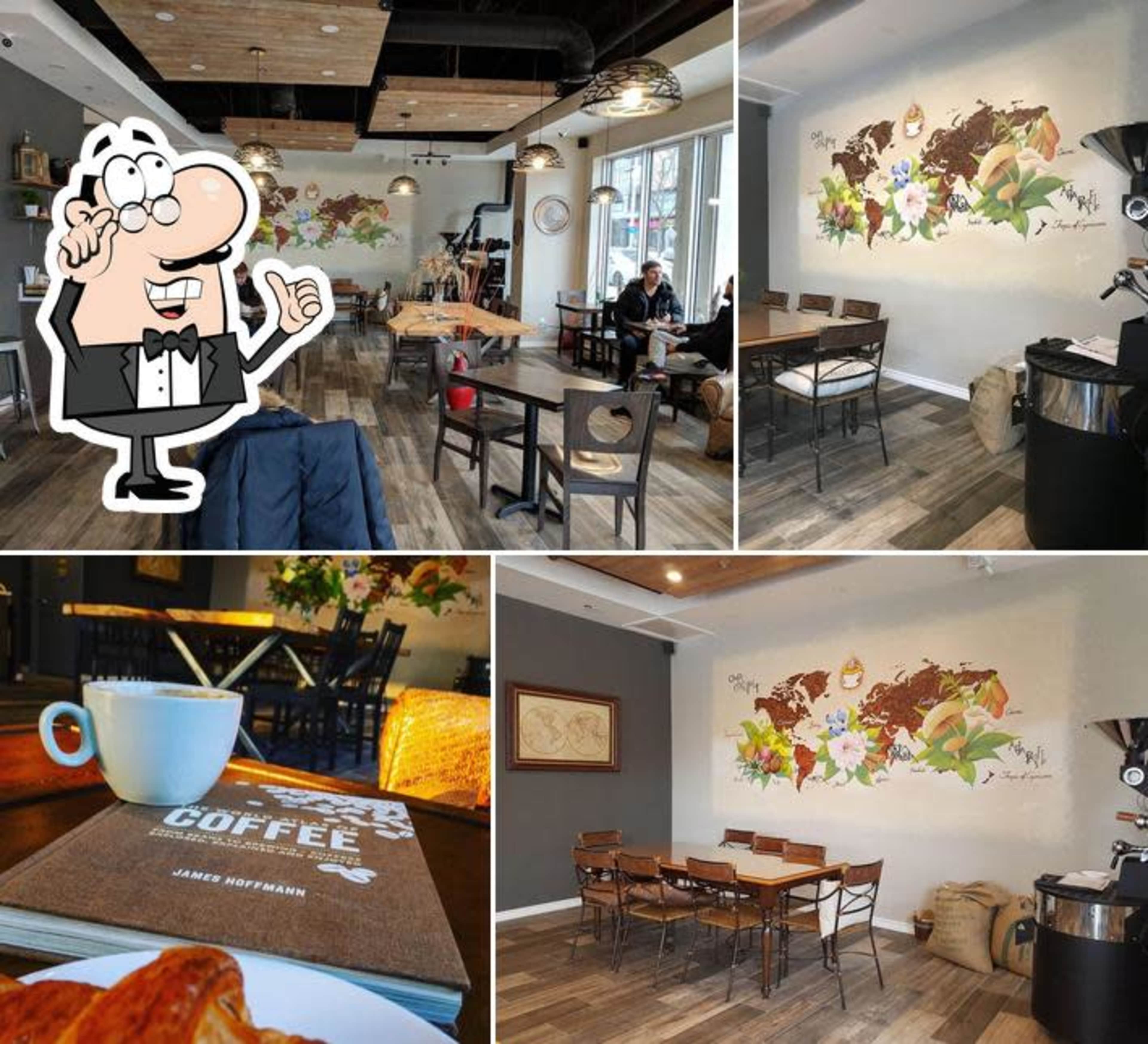 A stylish coffee shop interior with wooden flooring, tables, and a decorative wall mural featuring floral elements.