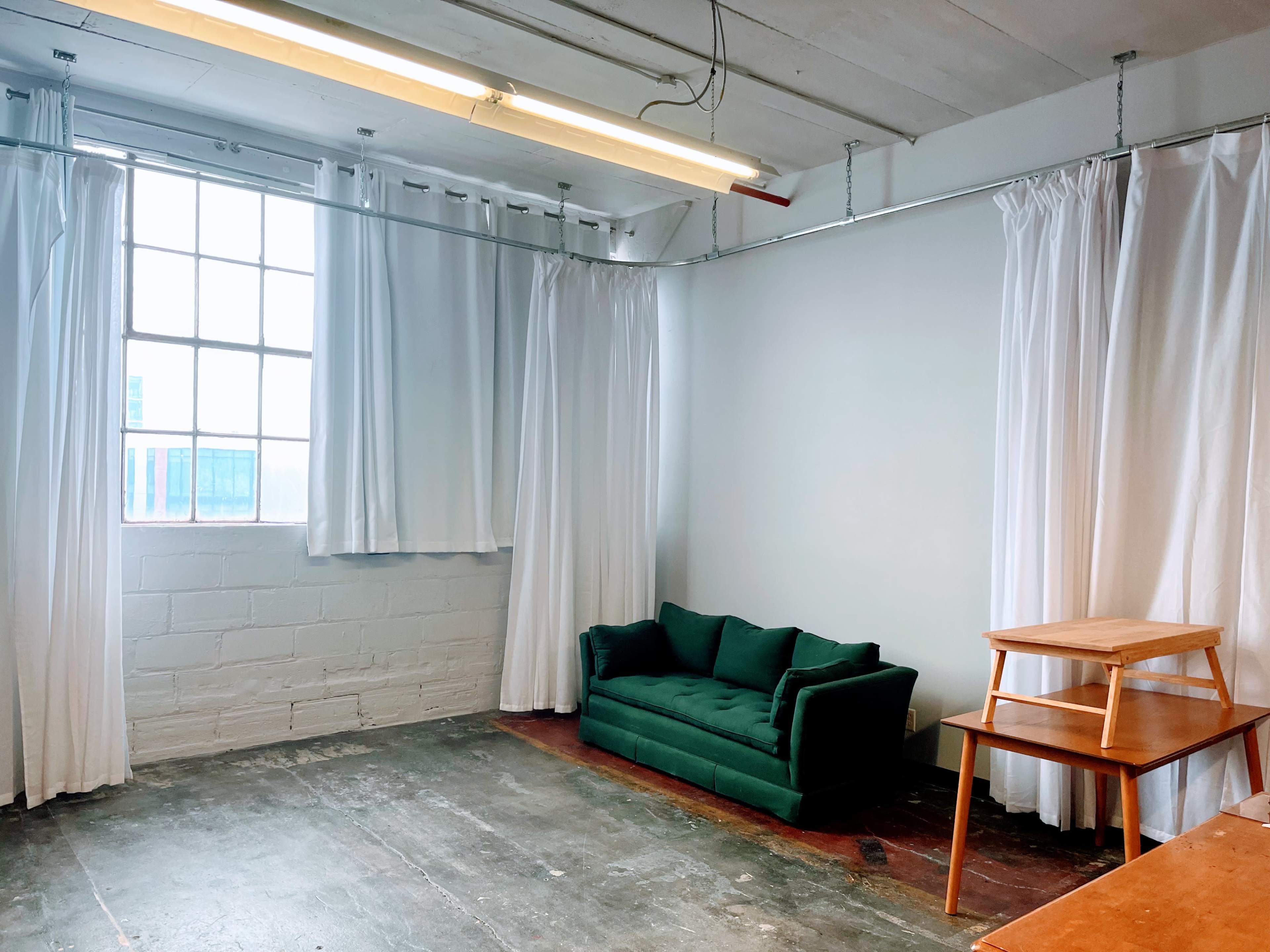 Natural Light-Filled Warehouse Studio with Harbor Skyline View Image in Bay View, Milwaukee, WI