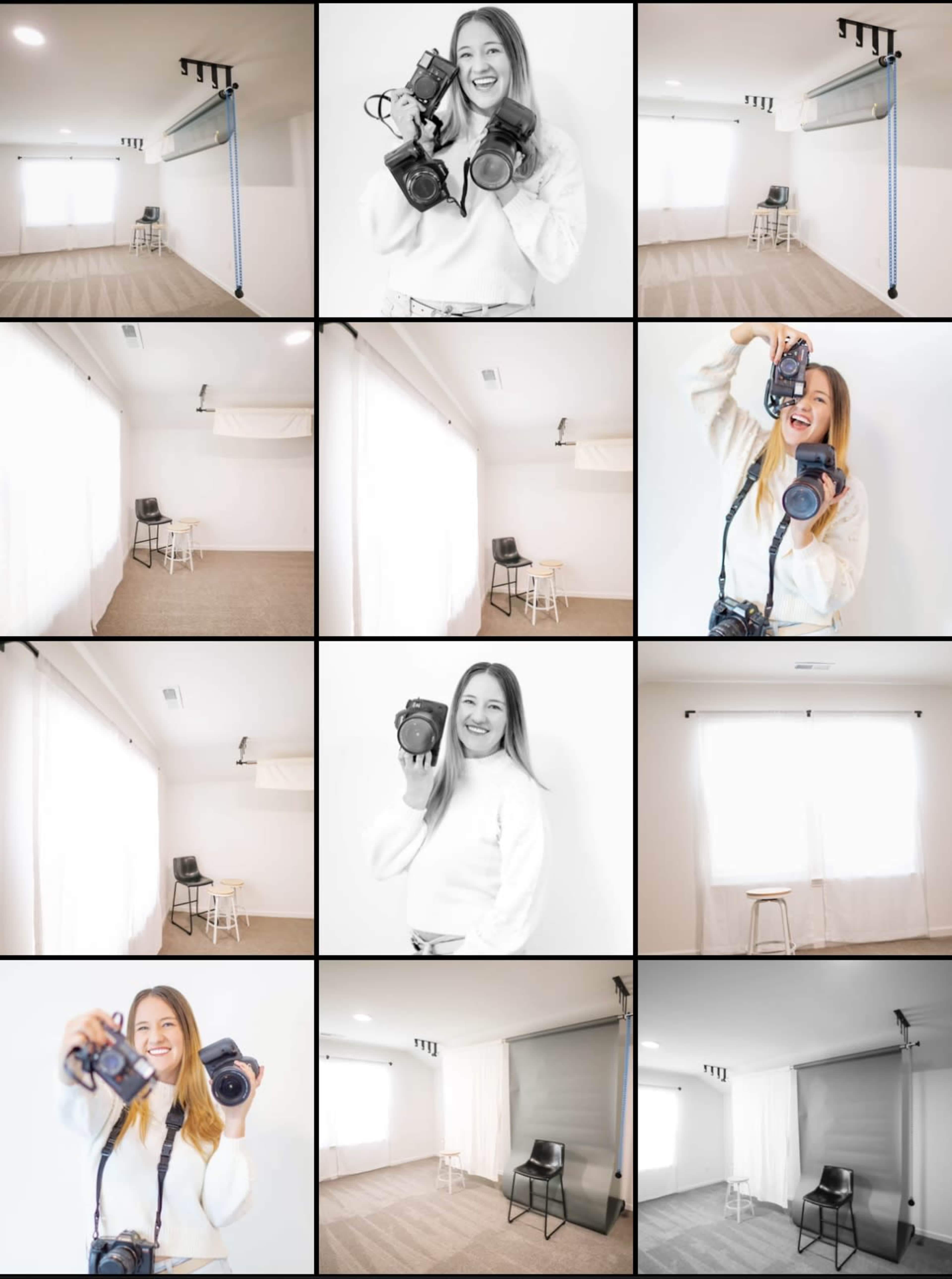 A woman holding cameras poses in a bright, minimalist photography studio with large windows and sparse furnishings.