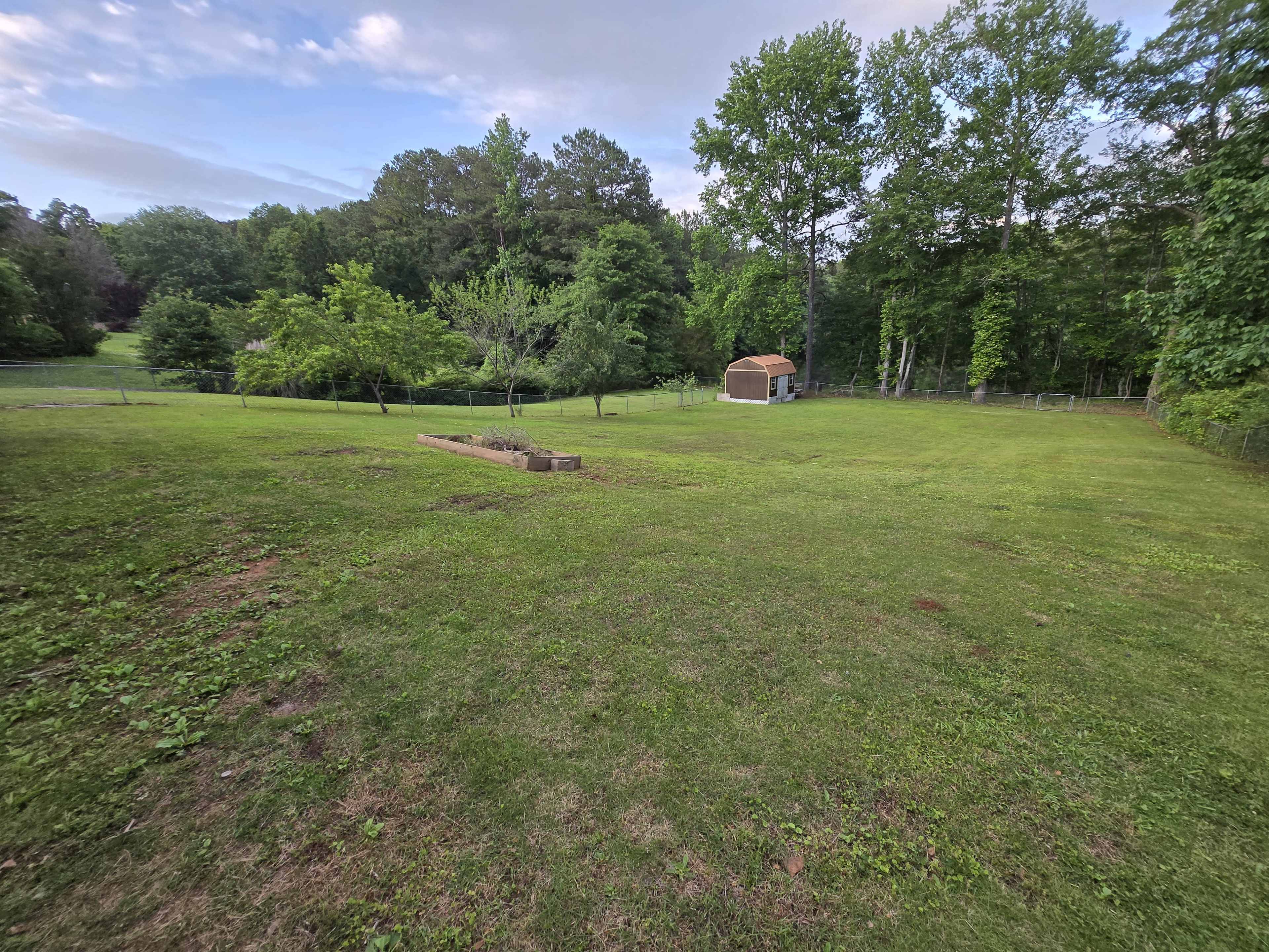 Large backyard with pond view Image in , Stockbridge, GA