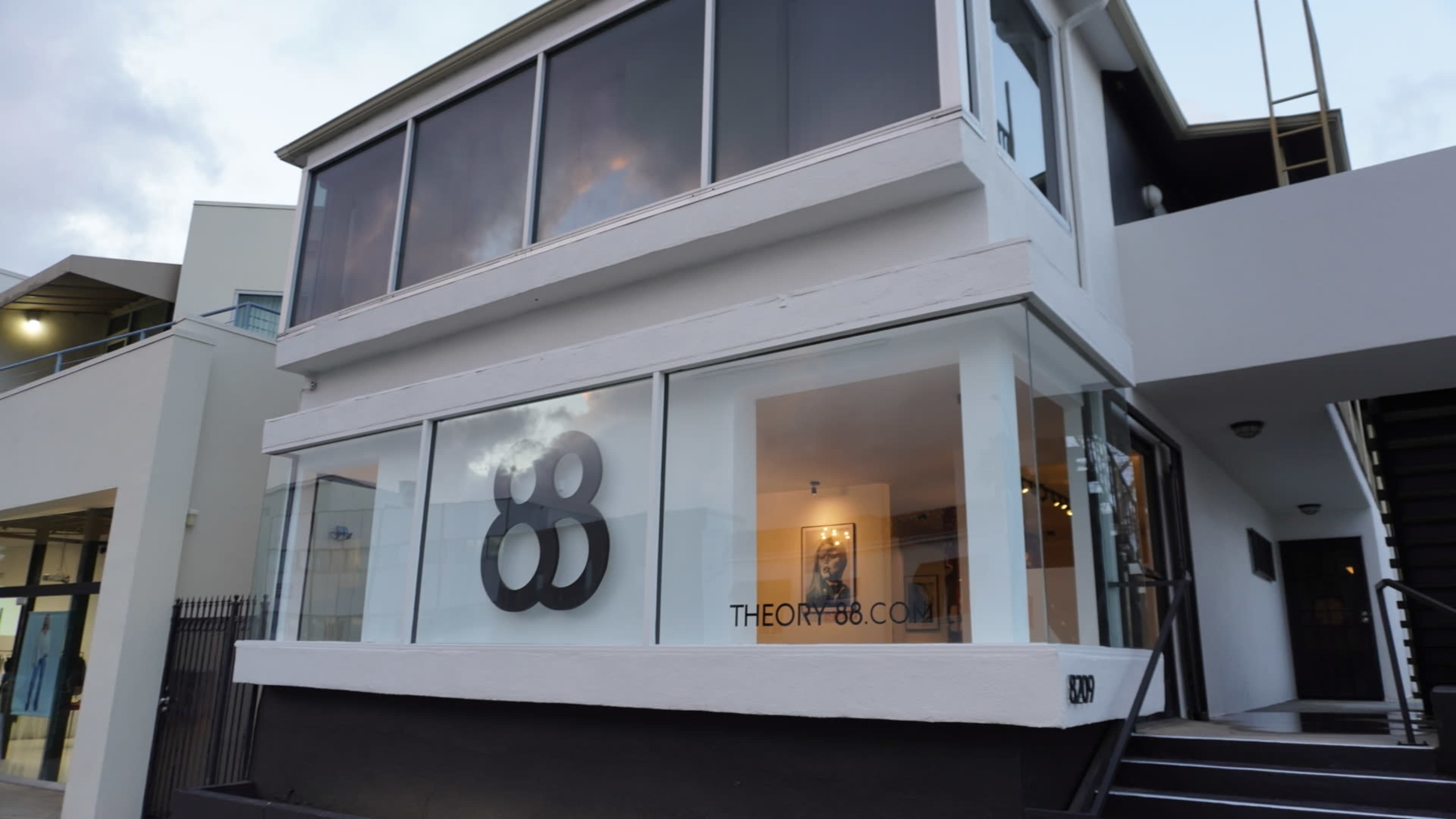 The building features large windows with a prominent "88" logo displayed on the front.