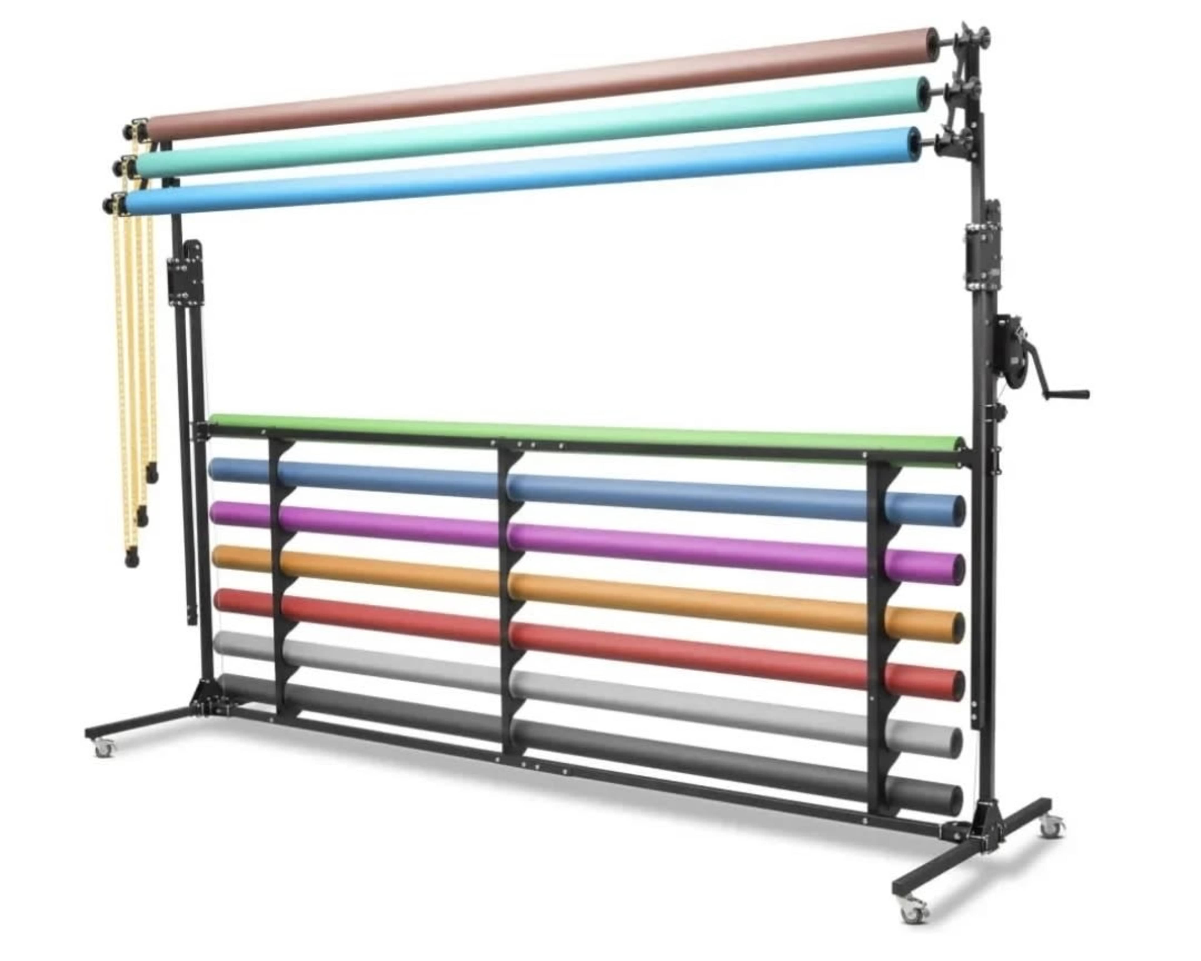 The image shows a photography backdrop support system with multiple colorful rolls of paper mounted on a sturdy black frame.