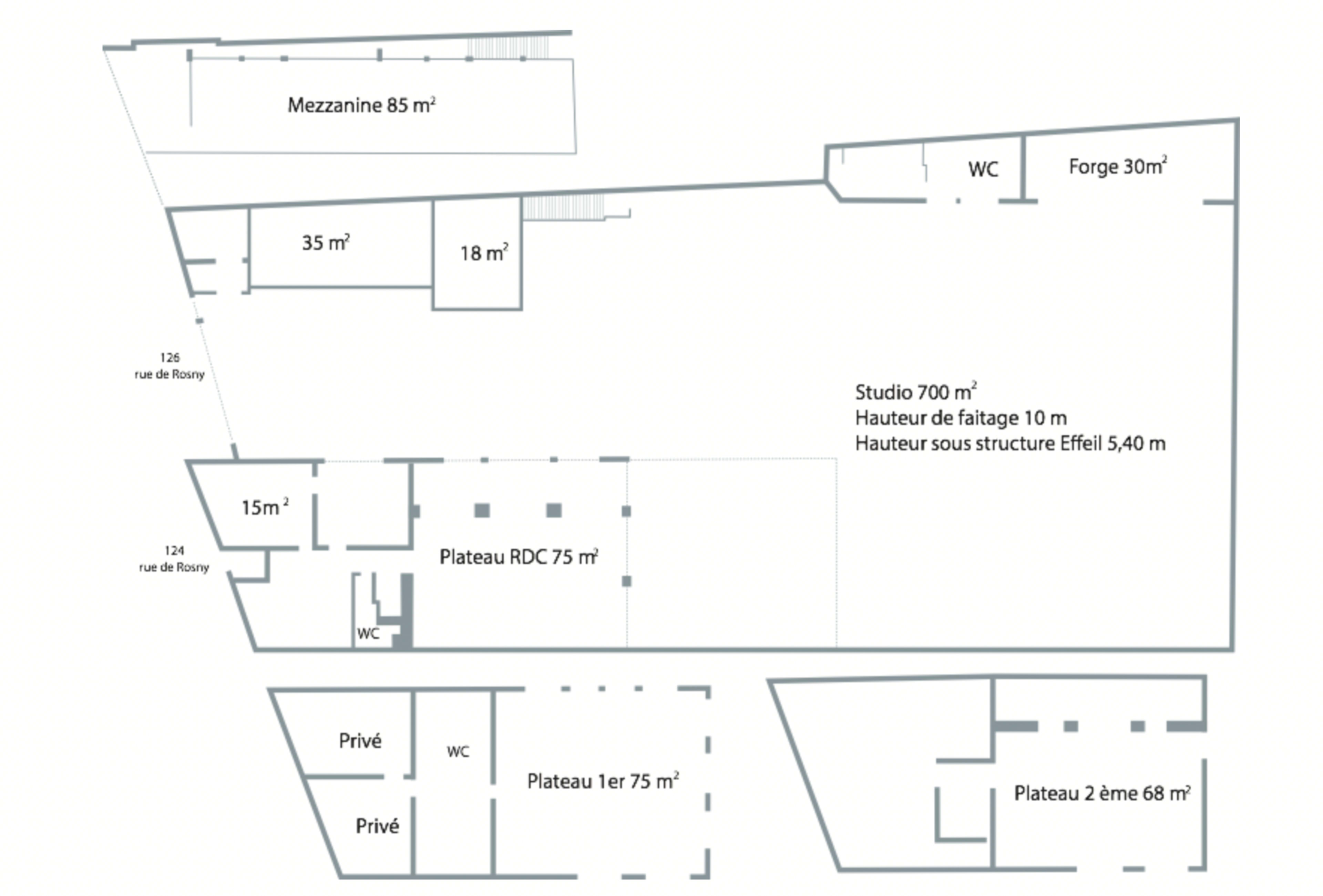 A floor plan labeled with various rooms and dimensions, including a studio, mezzanine, and several other spaces, alongside restrooms and designated areas.