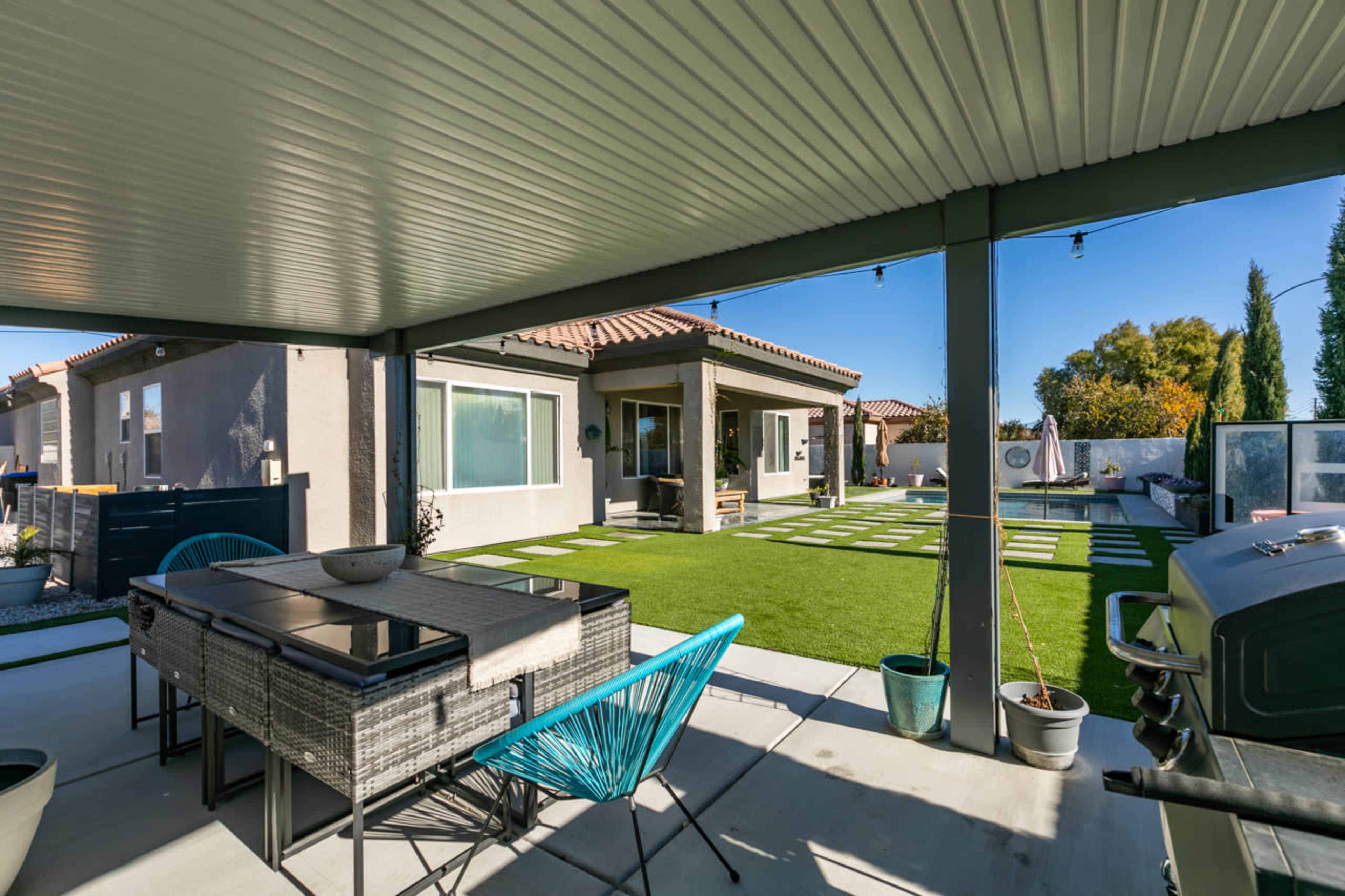 Whimsical Private backyard with pool , patio, fire pit in quiet North West Las Vegas neighborhood. Image in Wyeth Ranch, Las Vegas, NV