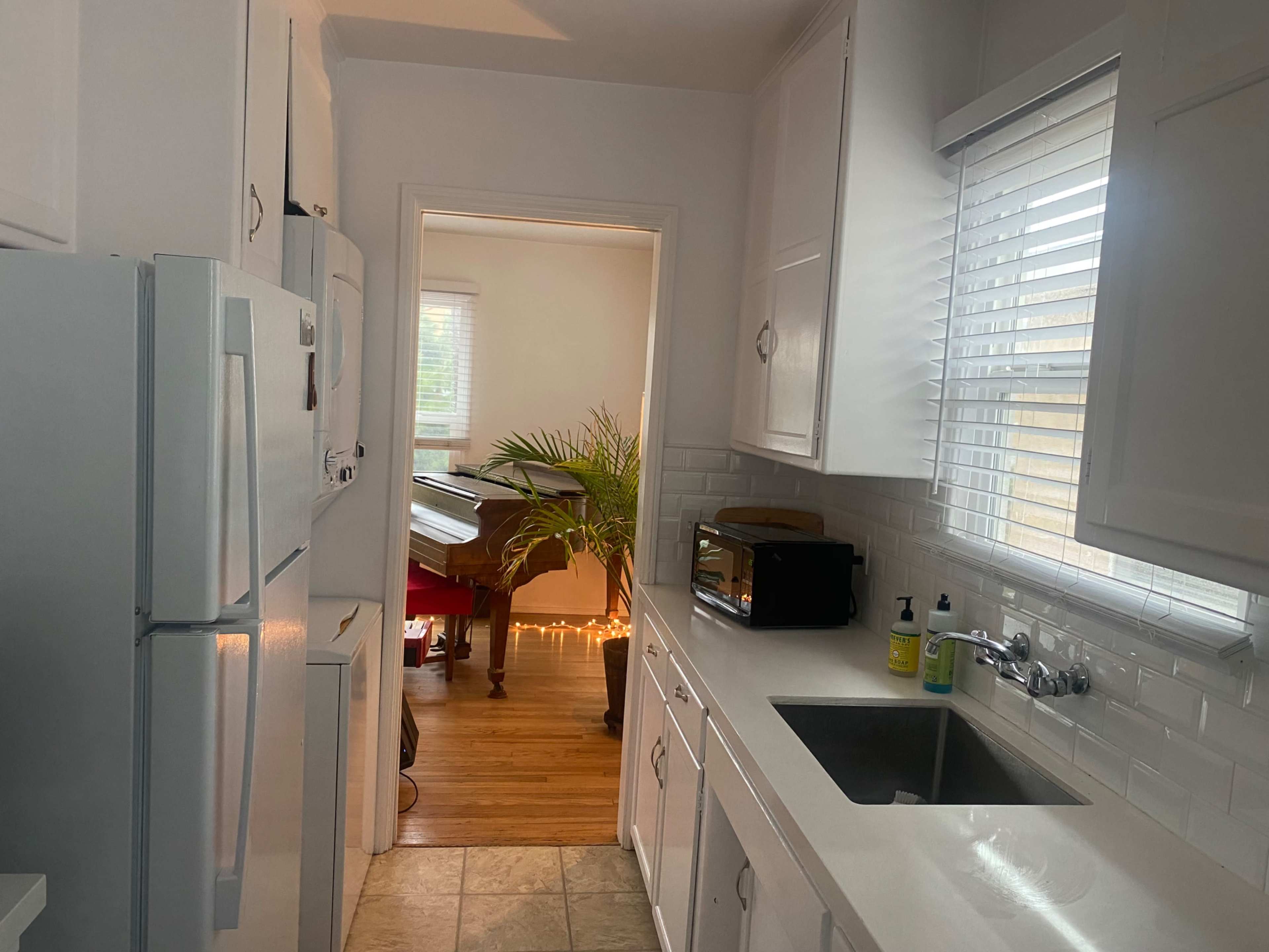 Multipurpose clean open room and kitchen with wood floors. Great for booking private clients for yoga, recordings or meetings of all sorts Image in Point Loma Heights, San diego, CA