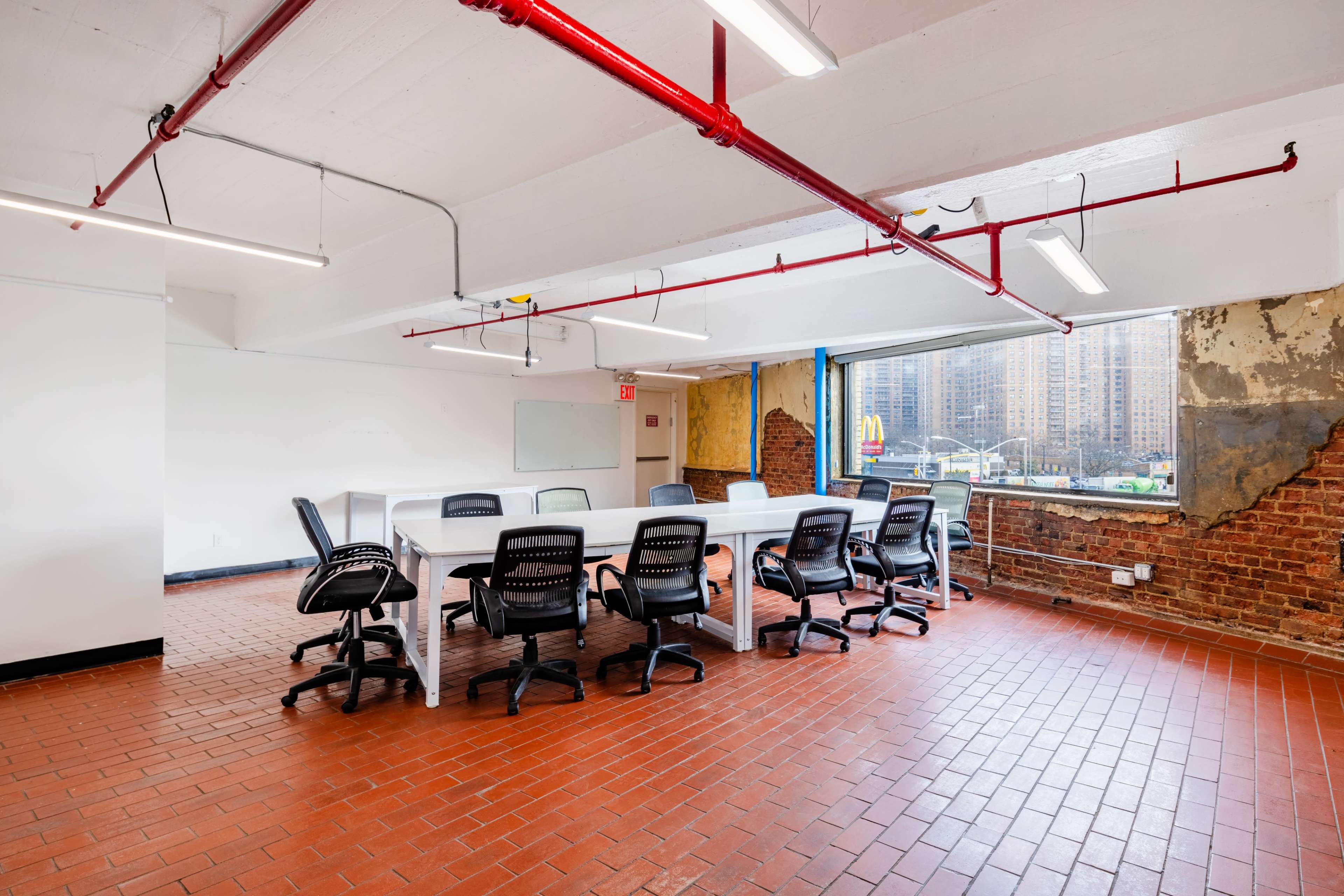 BKLYN Commons The Washingtom room,  Open spacious meeting room with natural sunlight and a rustic feel. Image in Little Caribbean, Brooklyn, NY