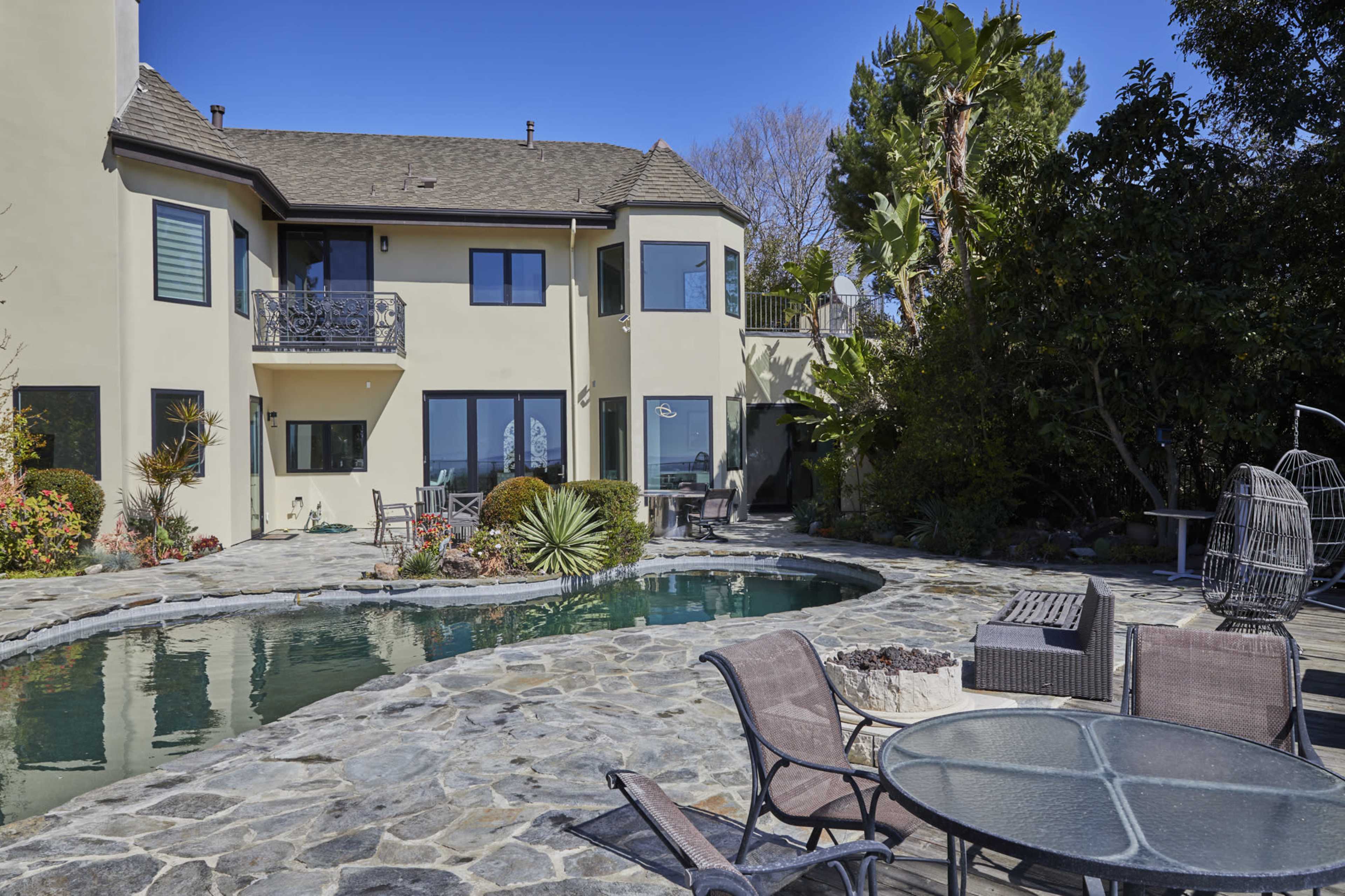 Stunning Bel Air mansion offering breathtaking views of West Los Angeles, rolling hills, majestic mountains, lush greenery, and the sparkling Pacific Ocean Image in Beverly Crest, Los Angeles, CA