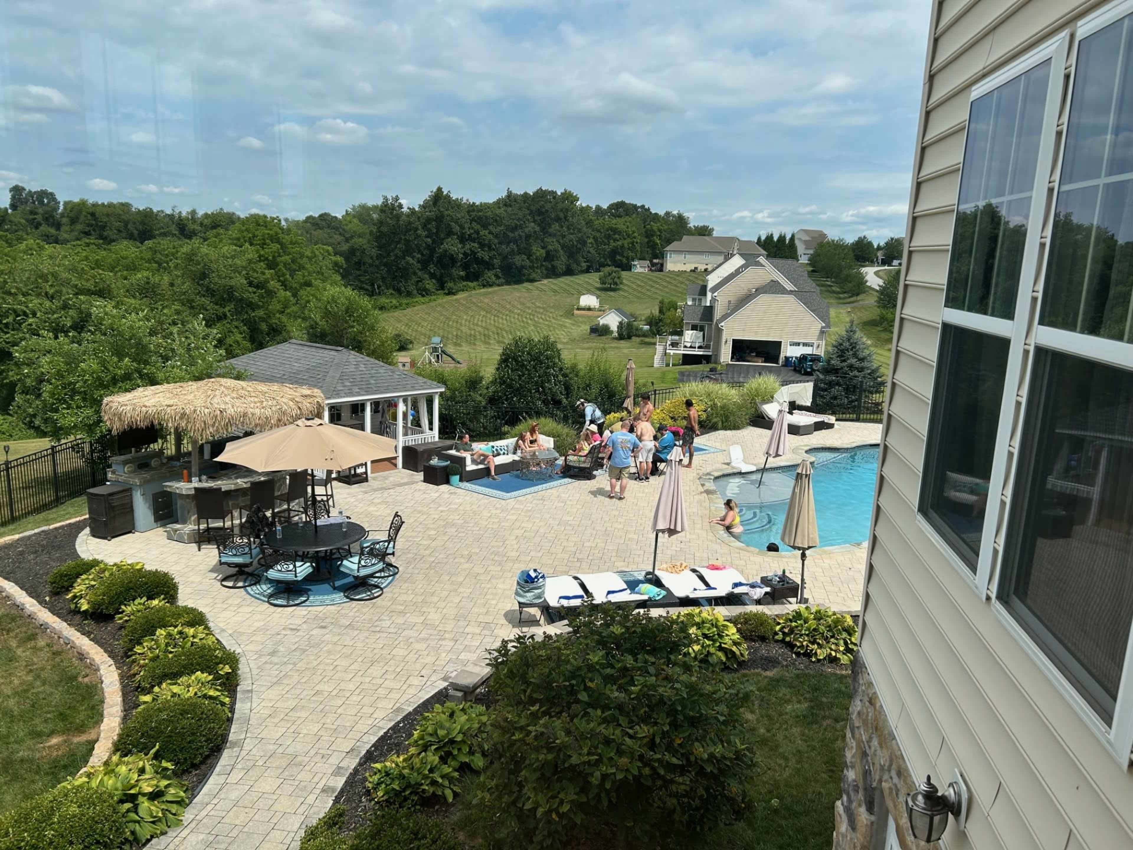 Modern Pool Oasis with Lush Privacy & Designer Lounge Area with Tiki Bar and Resort feel Image in , Westminster, MD