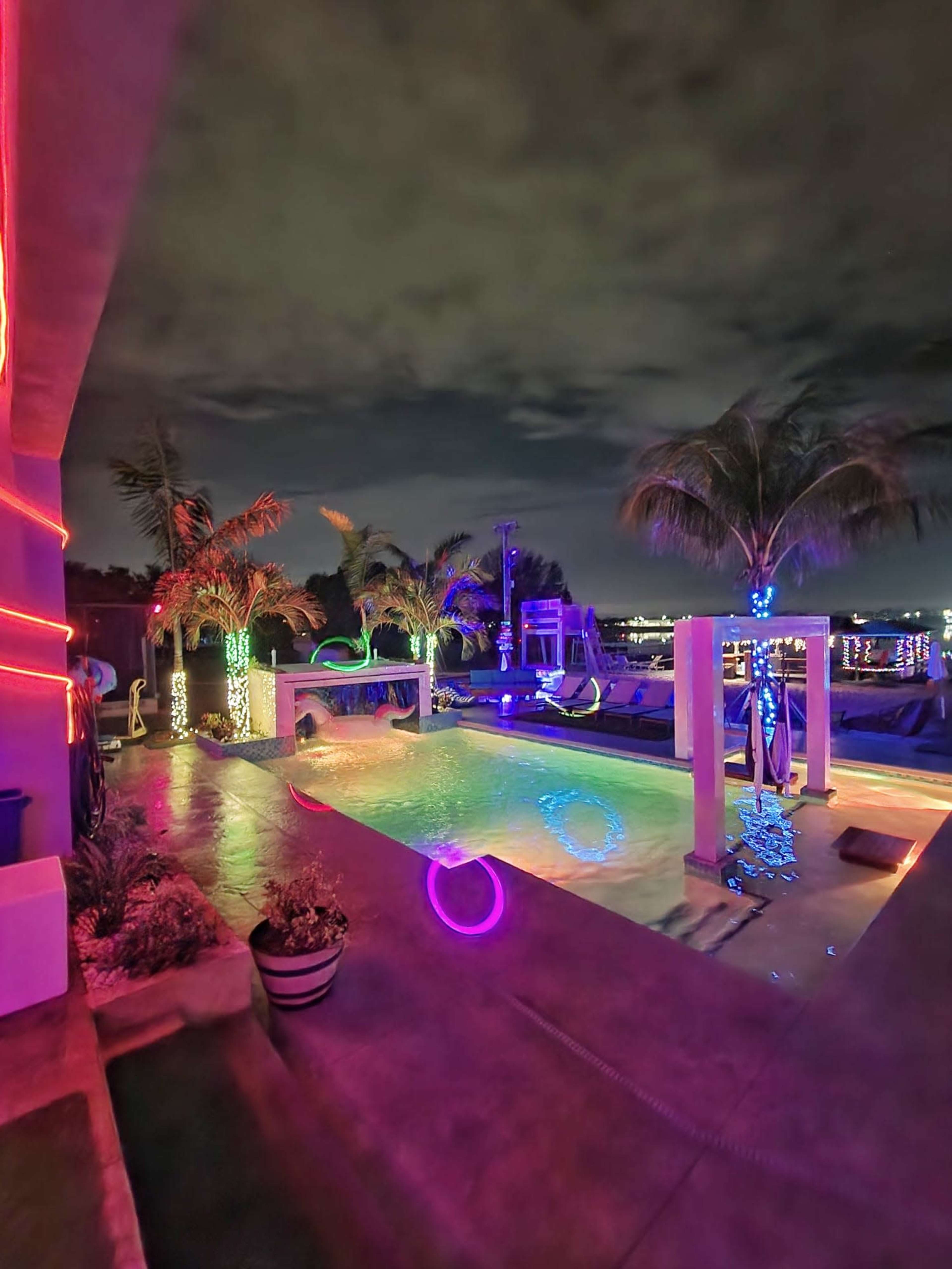 Lakefront grotto Palm Oasis, Sand Volleyball, and Custom Pool Features Image in , Orlando, FL