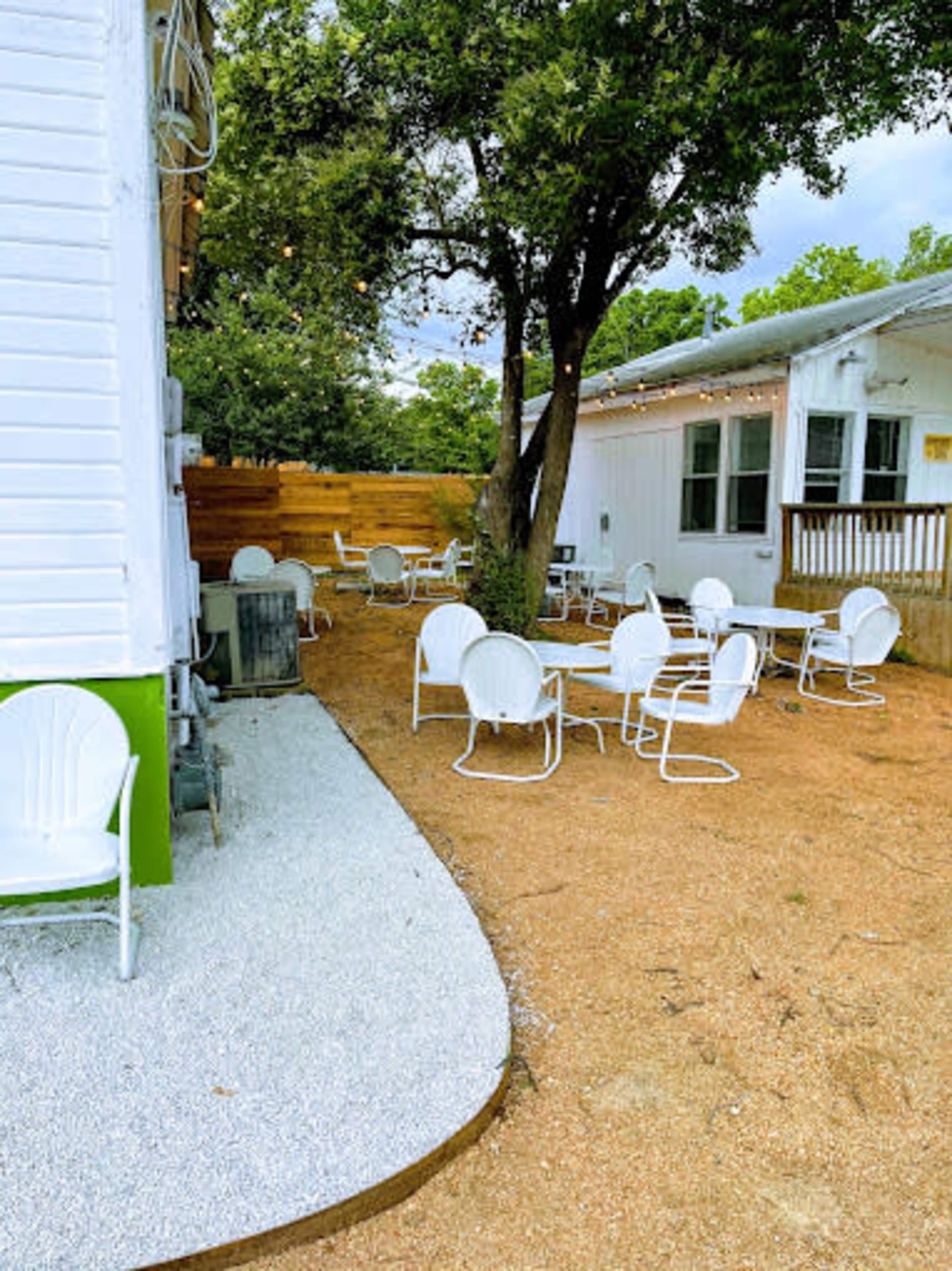 Cute historical house with a huge patio and lovely vibes. Image in Montopolis, Austin, TX
