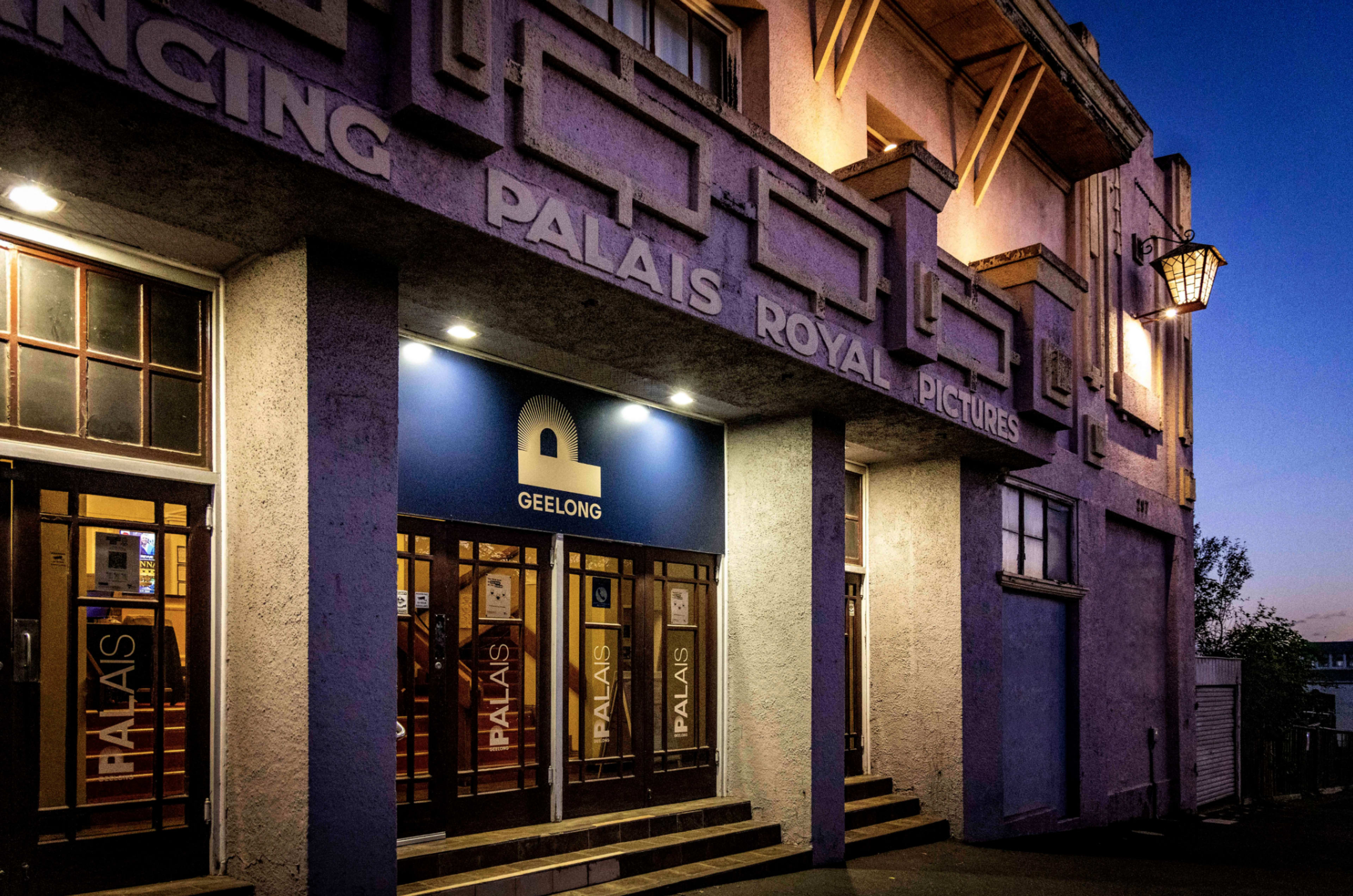 The entrance of the Palais Royal Pictures building in Geelong, featuring a large blue sign with the letter "P."