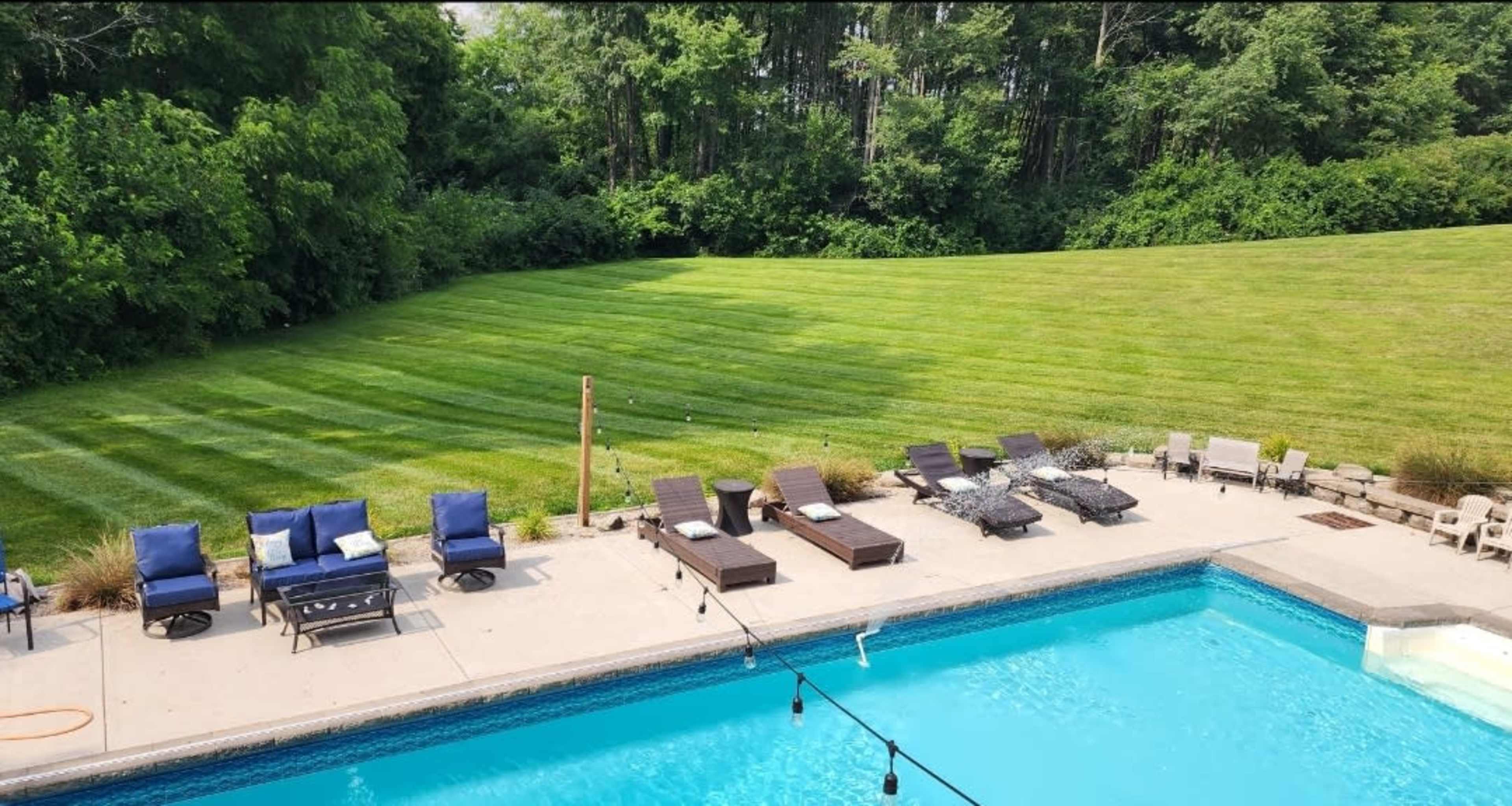 Beautiful farmhouse setting with huge inground pool with walkout basement. Image in Clark Township, Greenwood, IN