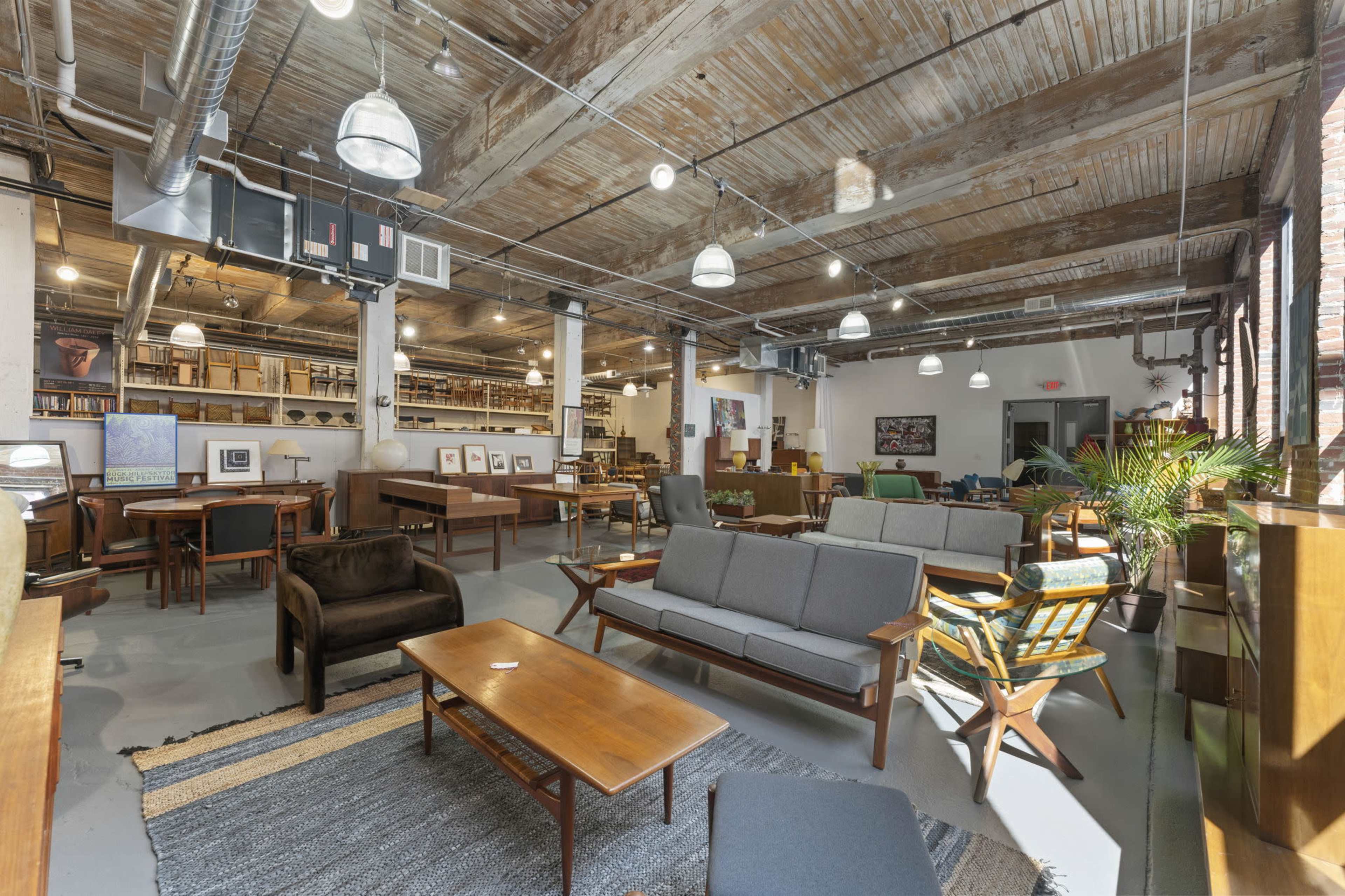 Industrial loft-style showroom filled with vintage mid-century modern furniture Image in Cheltenham Township, Wyncote, PA
