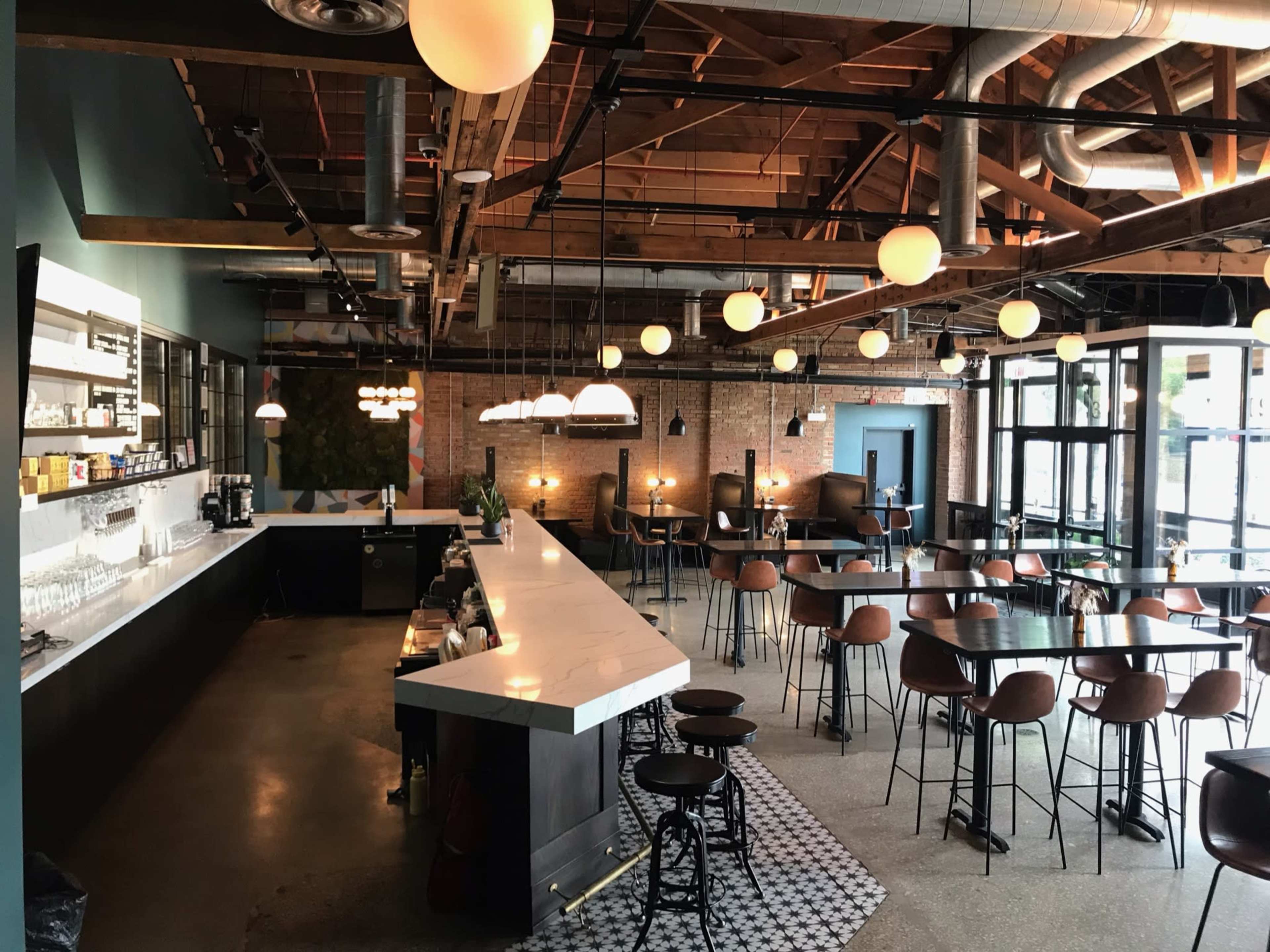 Industrial, exposed brick, wooden bow truss ceiling, brewery, taproom Image in Near West Side, Chicago, IL