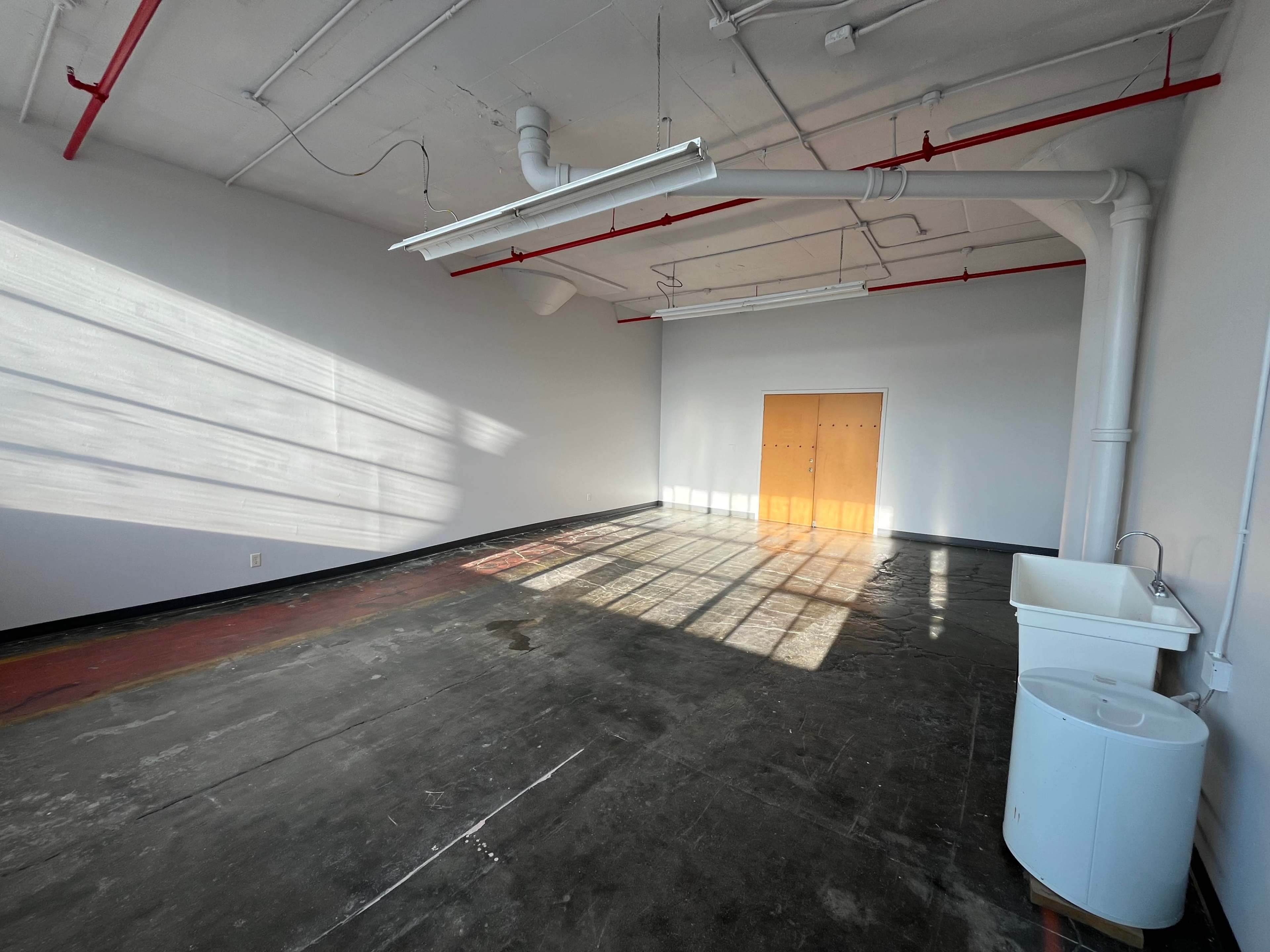 Natural Light-Filled Warehouse Studio with Harbor Skyline View Image in Bay View, Milwaukee, WI