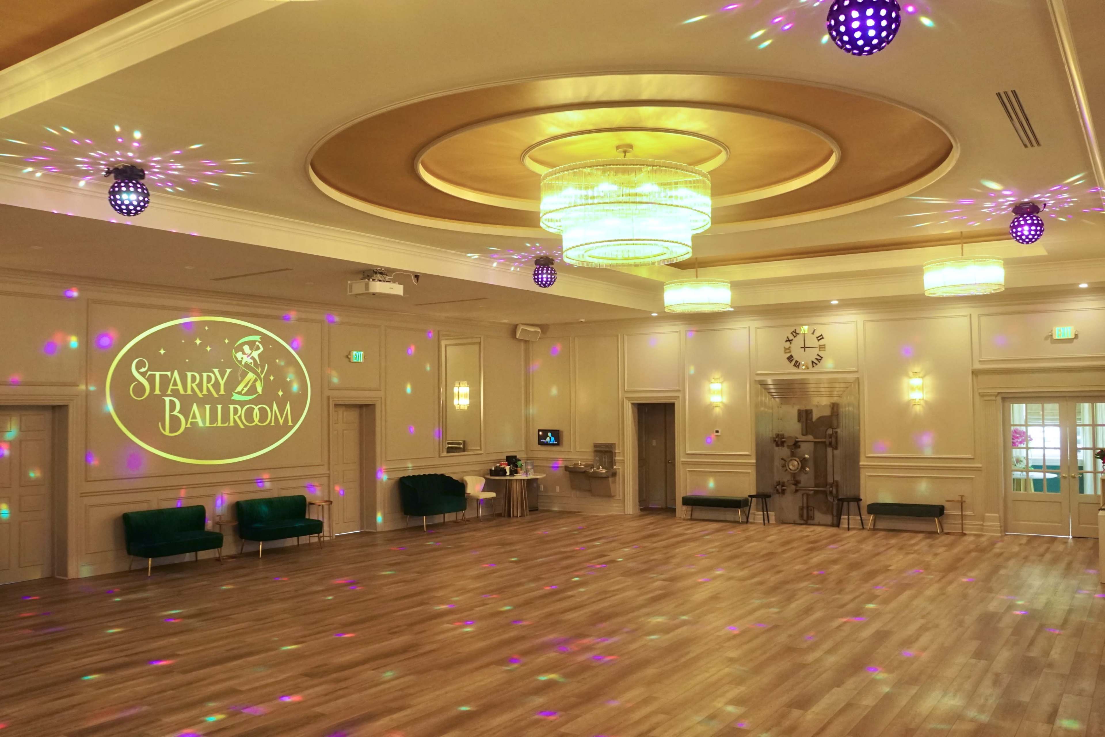 The image shows an elegantly decorated ballroom with a wooden floor, colorful lights projecting patterns on the walls and ceiling, and a large sign that reads "Starry Ballroom."
