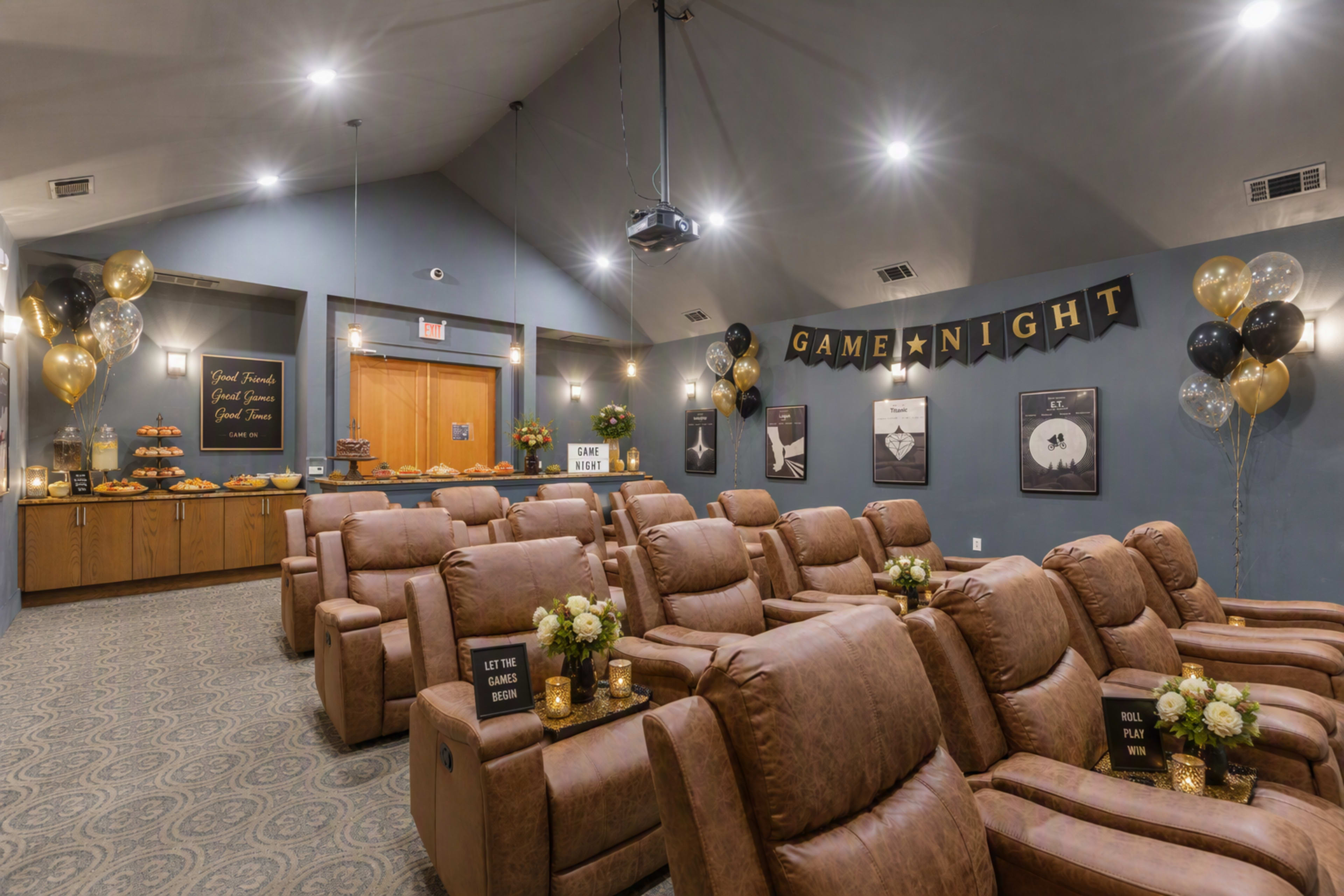 The image shows a cozy event space set up for a game night, featuring leather recliners, decorative balloons, a snack table, and themed wall decor.