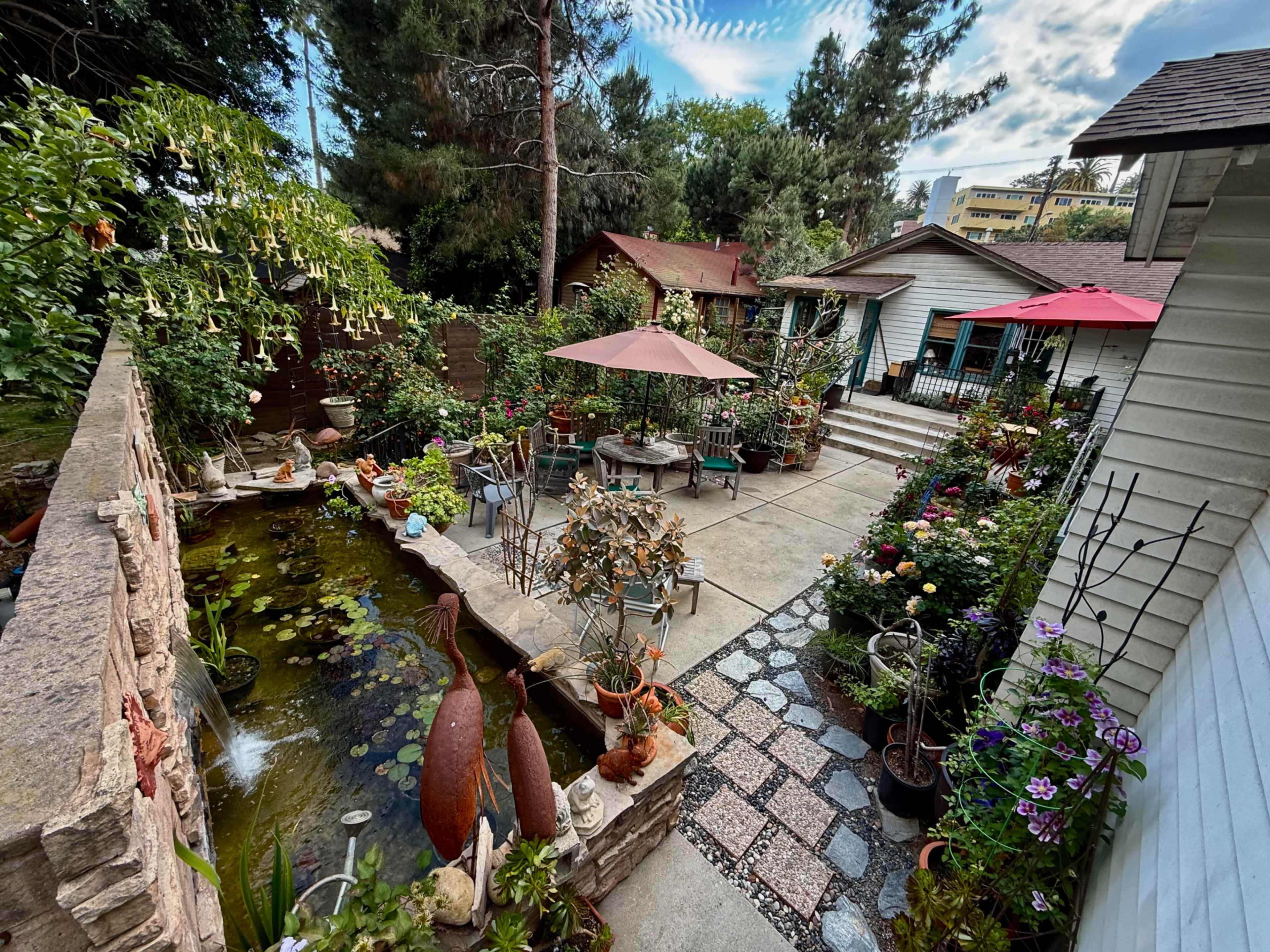 Expansive garden and outdoor space with covered driveway. In the heart of the Hollywood foothills, walking distance from the Hollywood Bowl and Hollywood Reservoir. Flowing walkways with many delightful nooks. The space includes a wardrobe and makeup room, with shower and full bathroom. Kitchen available upon request. Sound system available upon request. Aerial drone photography and video available upon request. Image in Central LA, Los Angeles, CA