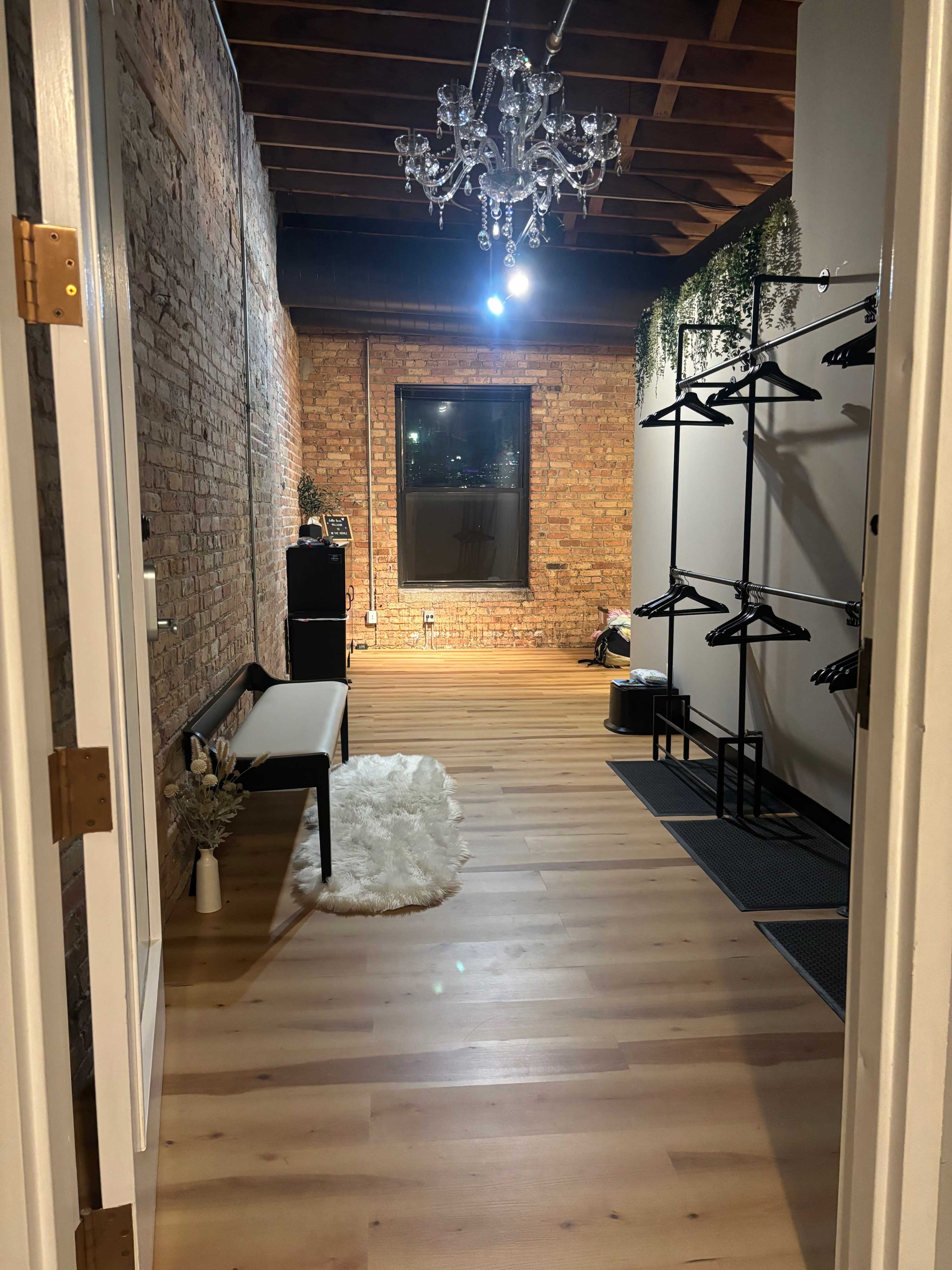 Beautiful timber loft fitness studio with equipment, skyline view and outdoor space. Image in Near North Side, Chicago, IL