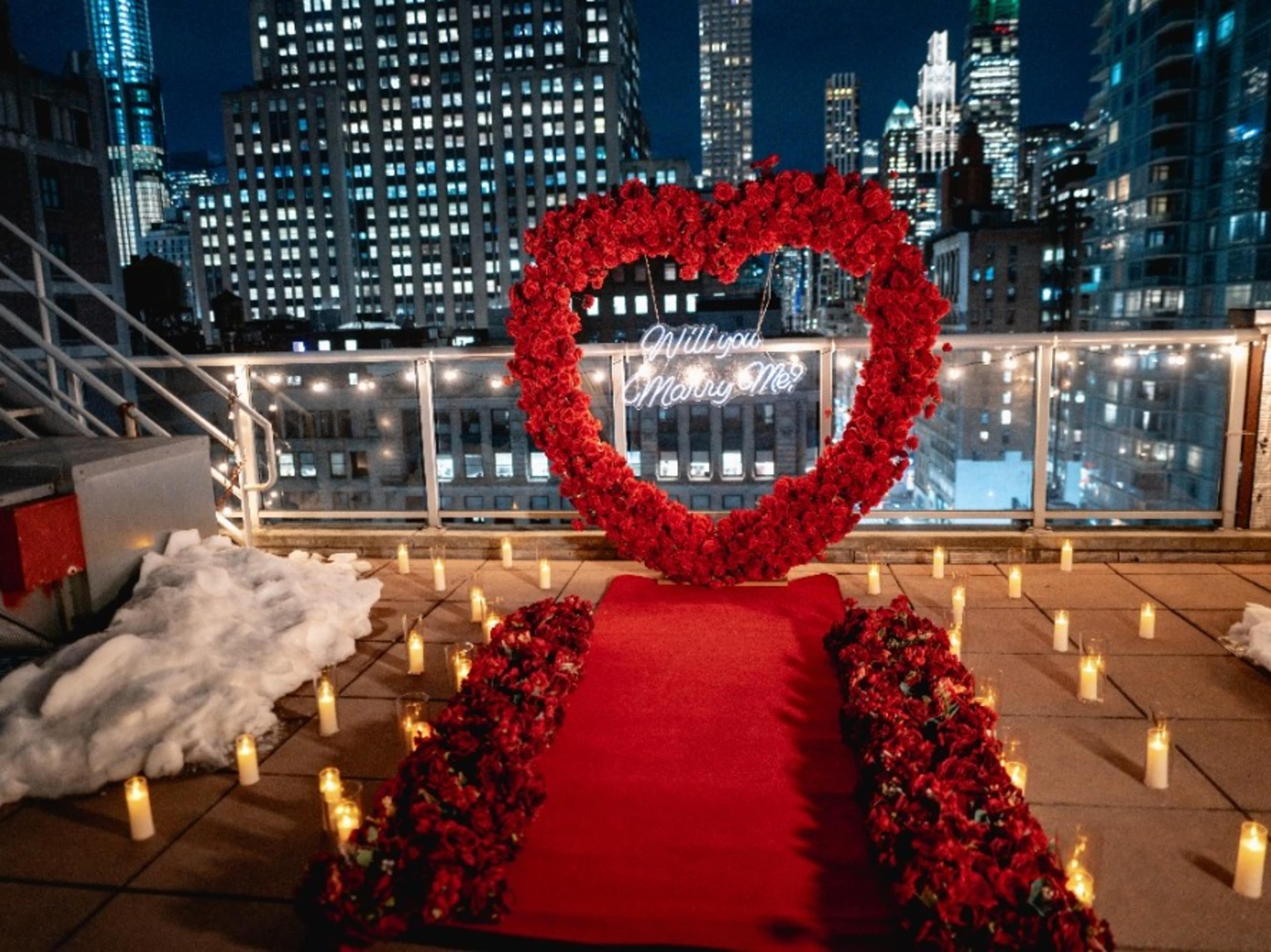 Red heart arch with neon sign