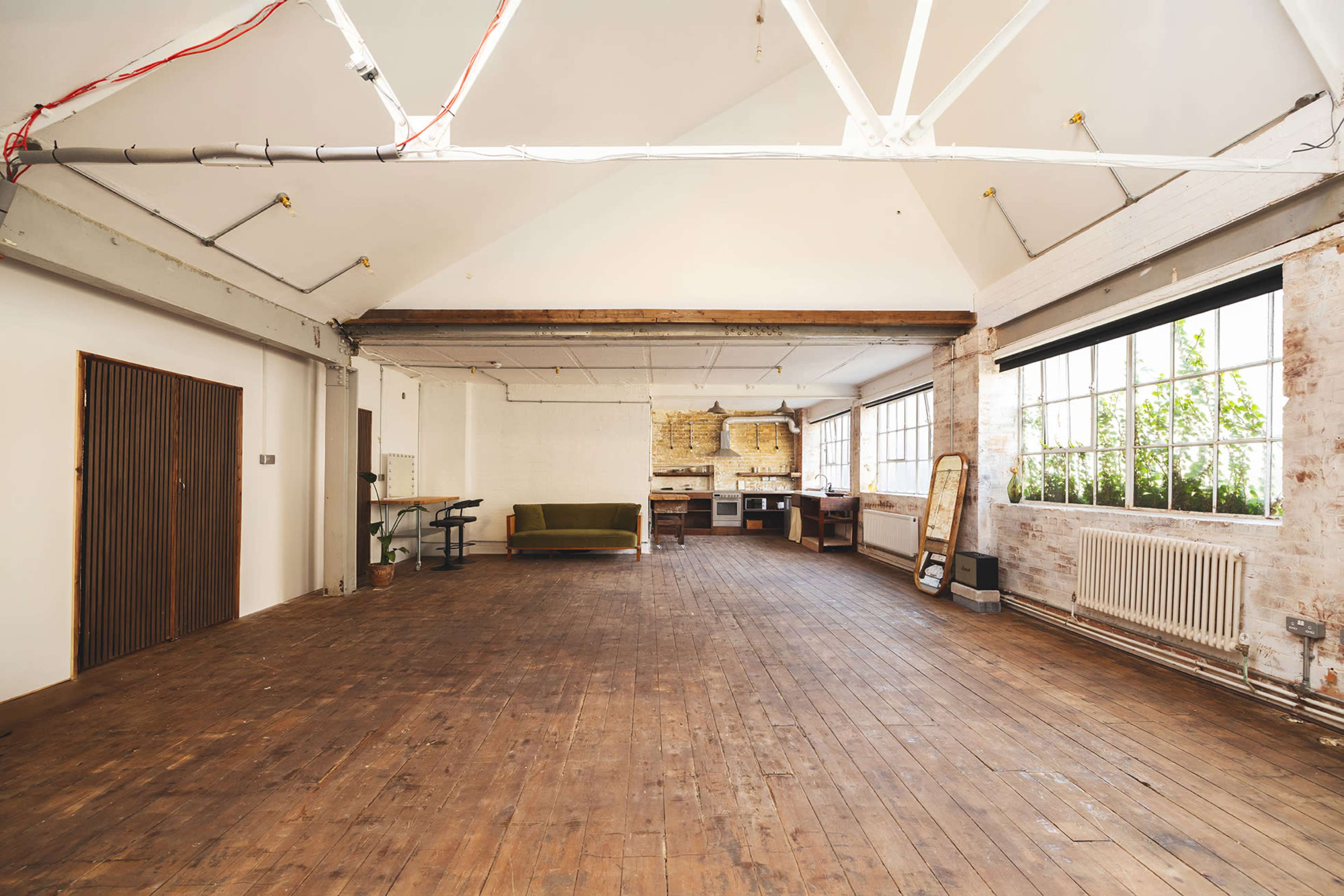 Warehouse Space with Kitchen , Wooden Floor and Brick walls Image in Dalston, london, ENG