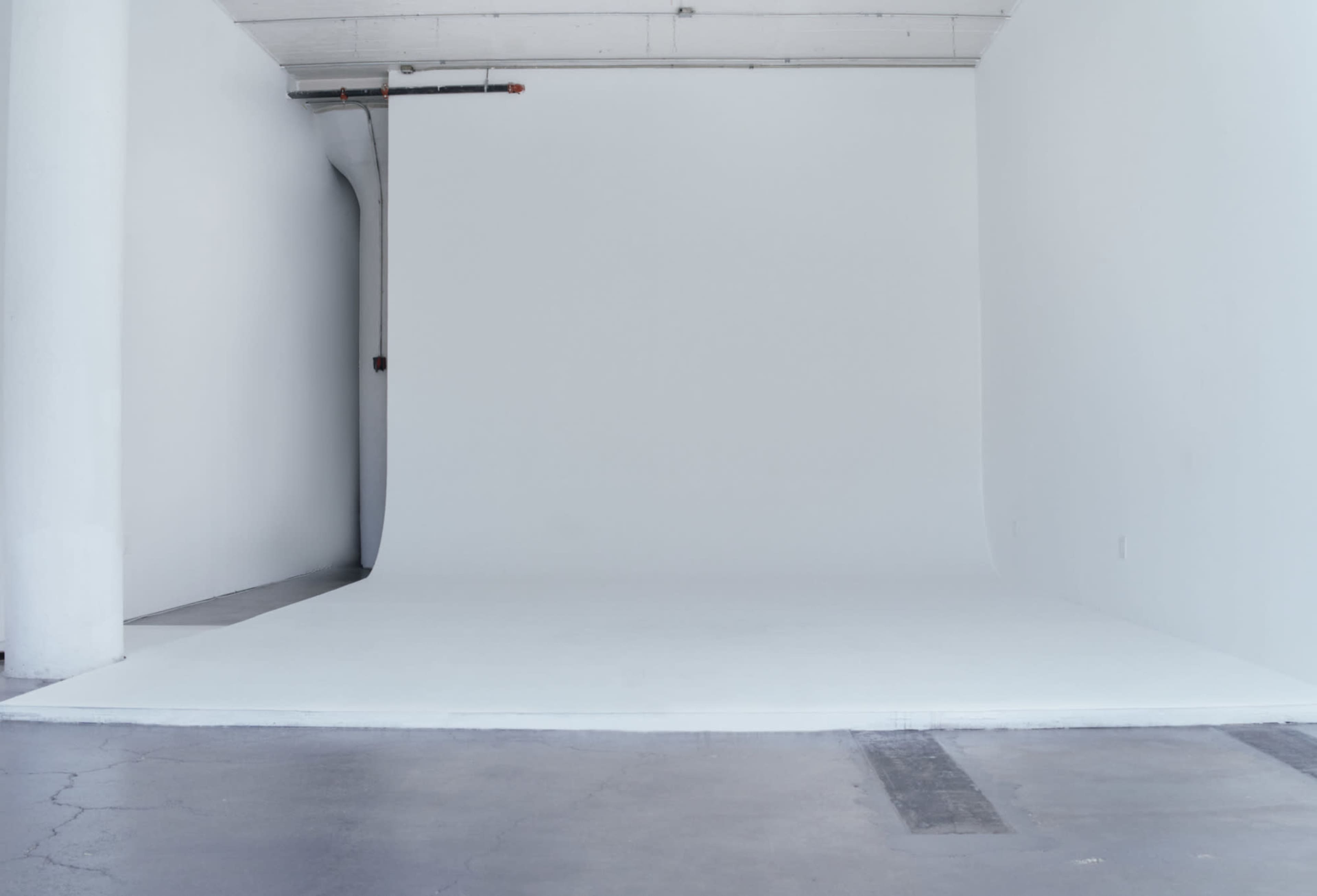 All white photo/video studio with CYC wall and concrete floors. White Rabbit Studio Image in Long Island City, Long Island City, NY
