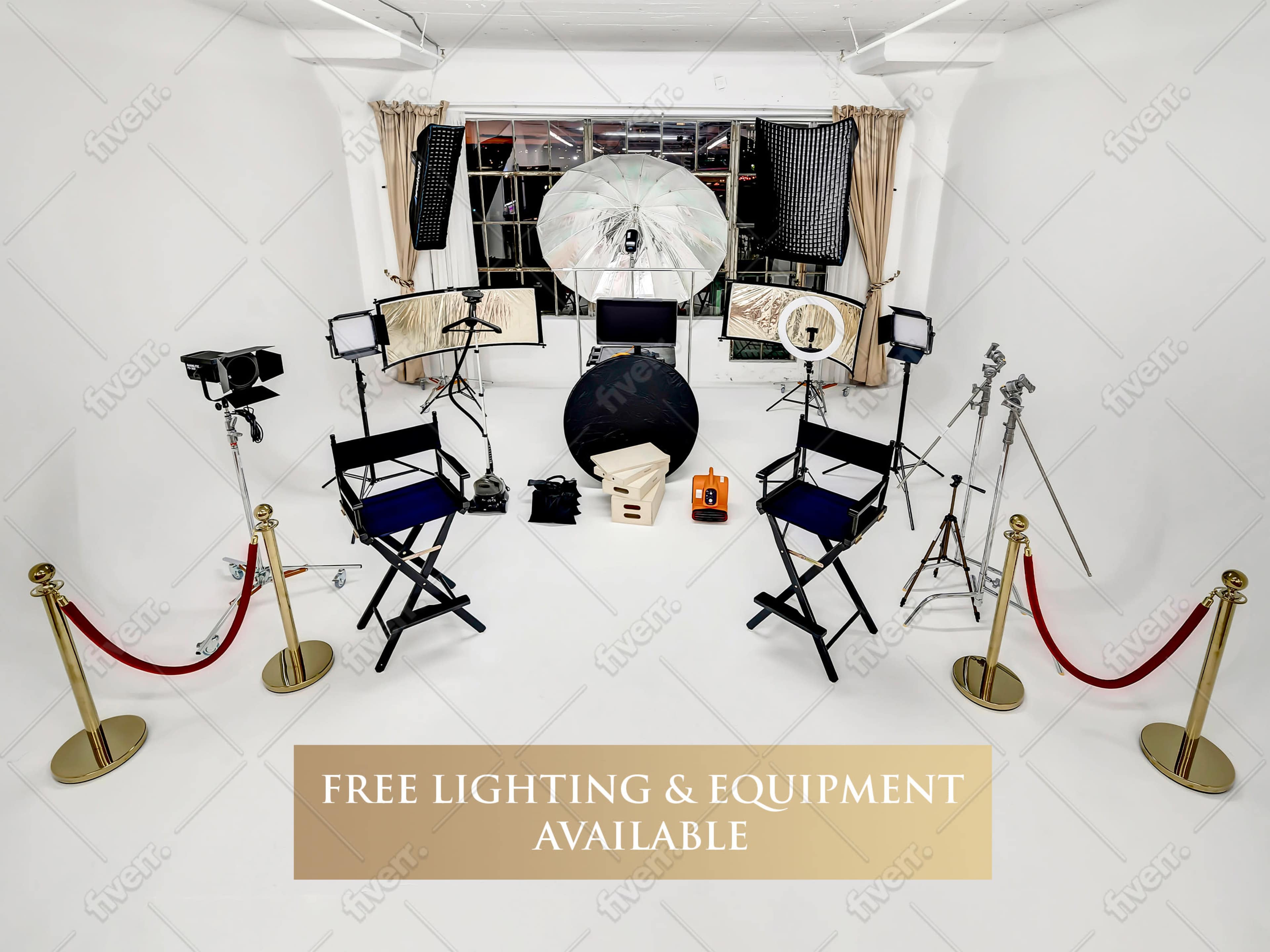 The image shows a photography studio setup with various lighting equipment, cameras, and two director’s chairs, all arranged in a white room.