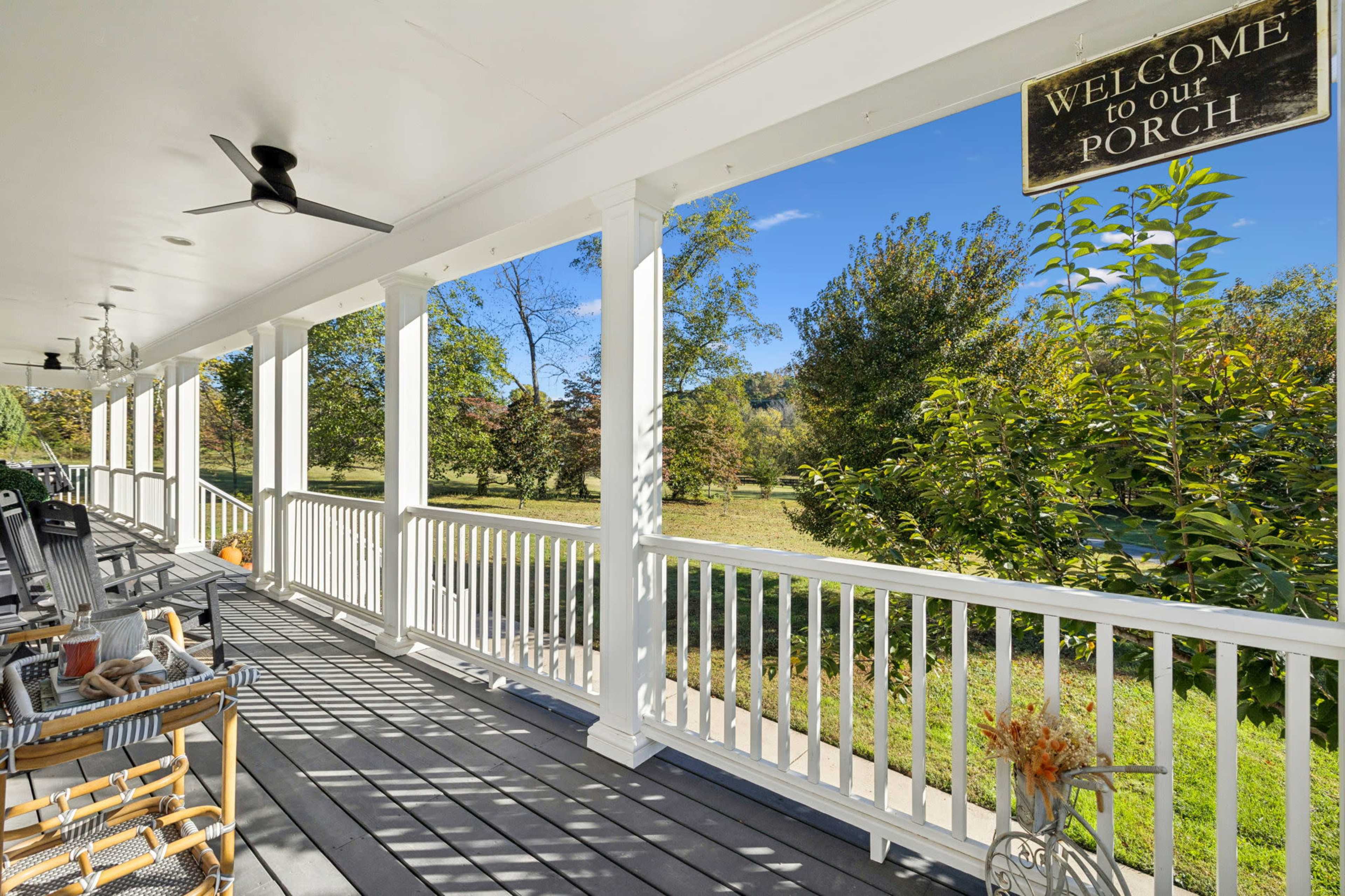 New Listing! A True Southern Porch — Wrap-Around Views, Rockers & Warm, Natural Light Image in , Fairview, TN