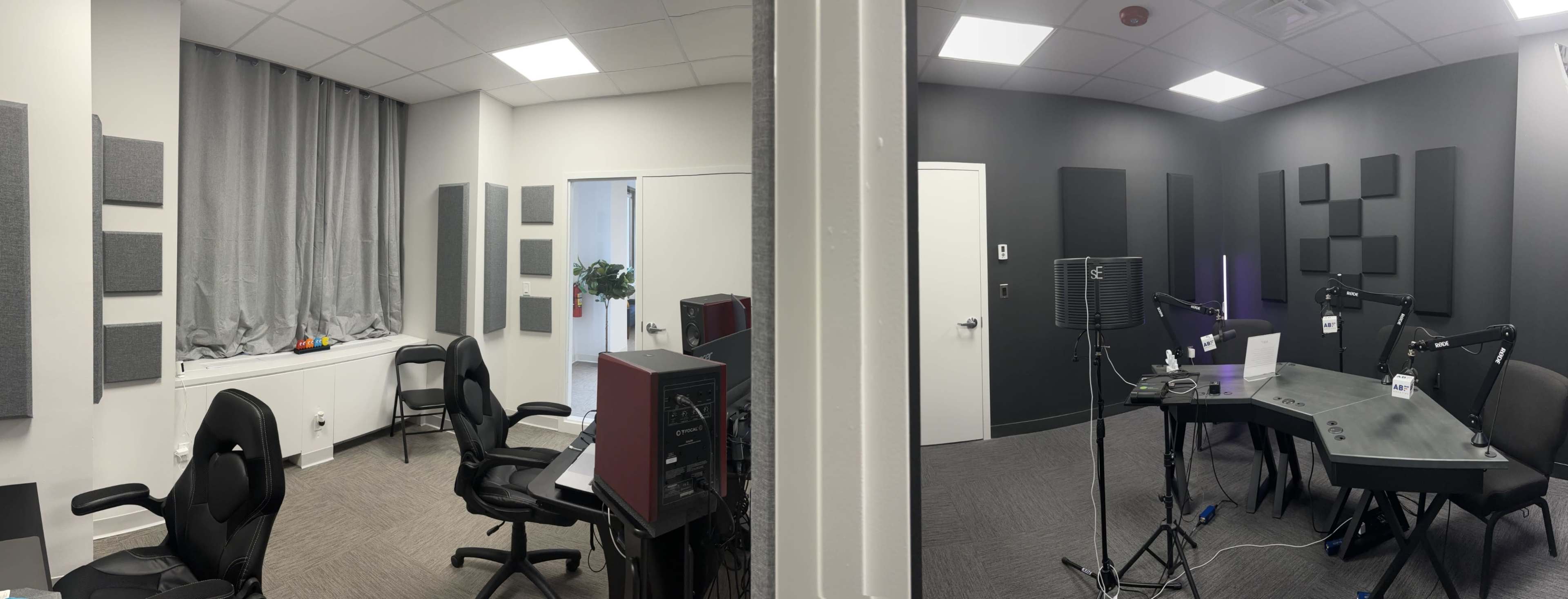 Two recording studio rooms, one with a large window and acoustic panels on the walls, and the other featuring a table and microphone setup.